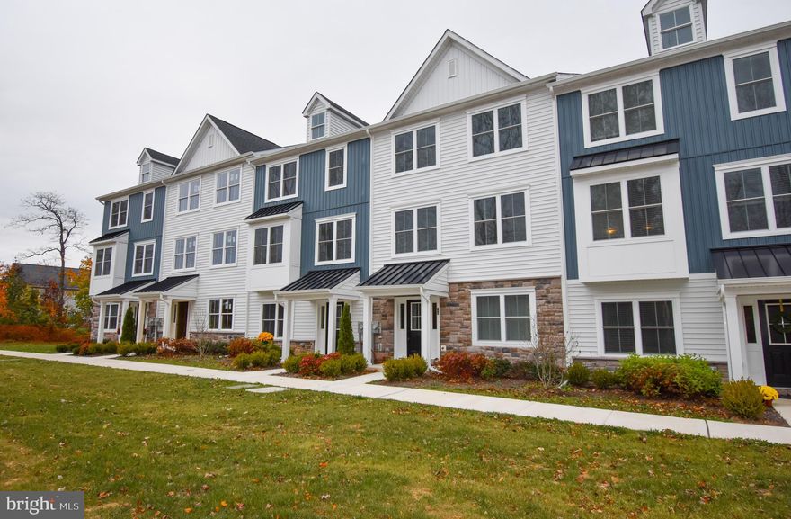 Tucked in a quiet yet convenient corner of rural Perkasie, this brand-new townhome in Avondale Walk offers the perfect blend of modern comfort and peaceful surroundings. Be the first to call it home.

The entry level features a versatile bedroom with a full private bathroom—ideal for a guest suite, home office, or additional living space. At the rear, you’ll find access to the finished garage, complete with interlocking flooring, wire shelving for organized storage, and an EV charger.

Upstairs, the open-concept main level includes a bright living area, dining space, and a gourmet kitchen with stainless steel appliances, quartz countertops, a large island, and a pantry. A door off the dining area leads to a spacious deck, perfect for outdoor relaxing or entertaining. A convenient half bathroom is also located on this level.

The top floor includes two comfortable bedrooms that share a full hall bath, a laundry room with a brand-new washer and dryer, and a primary suite featuring a walk-in closet and private bathroom.

This home also includes a whole-home water softening system for added comfort and convenience.

Avondale Walk features beautifully maintained landscaping, sidewalks, and walking paths throughout the community.

Trash services and lawn care are included in the rent.
Tenant is responsible for electric, gas, water, sewer, internet, and removal of snow/ice from the front walk.
No pets allowed.