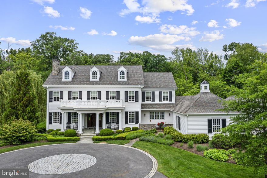 This custom-built colonial revival styled home was built by Bancroft Construction in 2013 and sits on over 2 acres. Impeccably maintained and tastefully designed, this 6 bedroom, 5 full and 2 half bath manor home offers all of the conveniences of modern living. Maximizing privacy and seclusion, this property backs to conserved space on 3 sides by Delaware State Nature Preserve with beautiful walking trails from the house and with direct connection to Valley Garden Park. Enter onto the property by way of security gate and courtyard driveway. The front portico ushers you into the stunning classic foyer where you immediately sense the grandeur of this home. The foyer is flanked through arched doorways by the formal living and dining rooms. Brazilian Cherry hardwood floors run throughout all main living spaces. The beautiful custom millwork is evident throughout the home. Head straight back past the formal powder room and elevator with access to all 4 floors, to find the in-home office with walls of built-in shelving as well as the bright sunroom with grass cloth wallpaper. The eat-in Chef's kitchen was designed by Paradise Custom Kitchen and features top-of-the-line appliances and finishes including custom cabinetry, paneled side-by-side Sub-Zero with 2 pullout drink drawers, Dacor six-burner range and double oven, warming oven, quartzite counters, two islands, two sinks, two dishwashers, and an accompanying butler’s pantry. The comfortable family room sits off of the kitchen with wood-burning fireplace, coffered ceiling, hidden storage closet and wet-bar with wine fridge. Through a pocket door beyond the kitchen is a large pantry, desk area, mudroom with lockers and informal powder room. Access the 2-car attached garage as well. Head to the second level by way of either the main or back staircase to find the luxurious primary suite with sitting room, large bedroom, coffee bar area with minifridge, French doors to a balcony and large California Closets walk-in closet with access to the 2nd floor laundry room. The beautiful primary en-suite features soaking tub, dual vanities, walk-in tiled shower, radiant floor heat and makeup counter. A second suite as well as 2 bedrooms sharing a Jack-and-Jill bath complete the second floor. Custom California Closet systems are in almost all closets throughout house. The 3rd floor features 2 additional bedrooms (one with large bonus room) and full bath. A laundry chute from 3rd floor leads to 2nd floor laundry room. The finished lower level offers great room with full kitchen and walk-out as well as full laundry room, a wrapping room, exercise room, and with a spare bonus room with full bath for guests. The private yard has been professionally designed and landscaped by Rodney Robinson and is fully fenced. The inground, heated saltwater pool with silver travertine patio surround was installed by Borsello as were both fire pits. Additional property features include whole house generator, Geothermal HVAC, house-wide wired security system and security cameras, Hardie board exterior siding, 4-car garage (2-car attached and 2-car heated detached garage), Grand Manor roof shingles, Loewen custom windows throughout, Sonos system with speakers throughout main level and lower level and two zones in the backyard, and a 20+ zone irrigation system servicing the entire property. The stunning home has left nothing more to be desired. With close proximity to downtown Greenville, Wilmington (Amtrak), and all major corridors this property has it all.