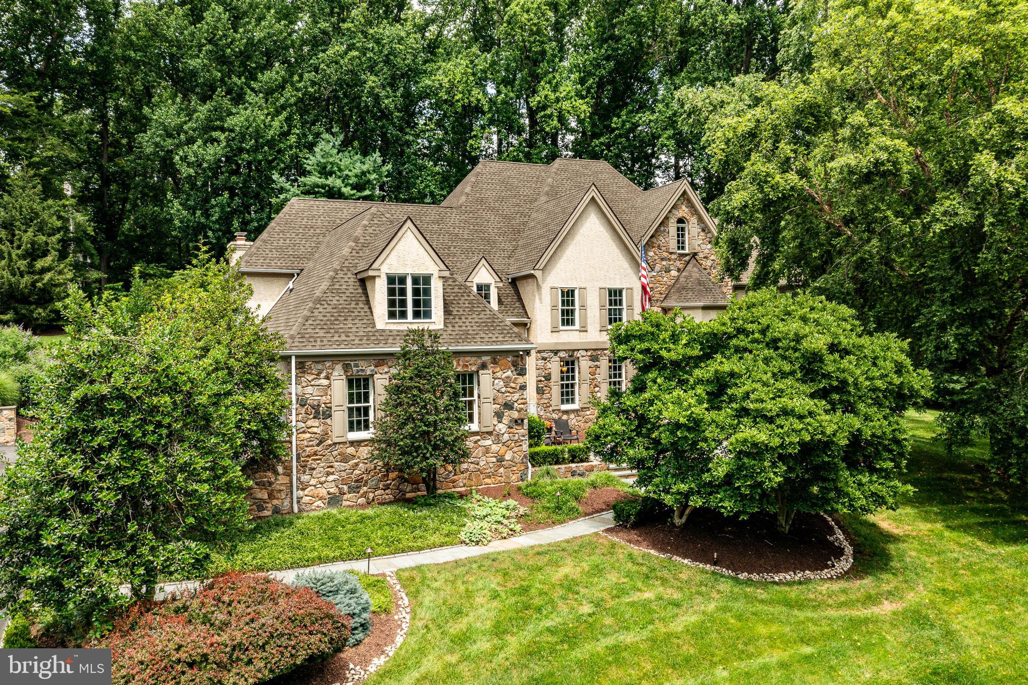 Welcome to 90 Indian Spring Road – your private summer sanctuary in the heart of Media’s highly desirable Indian Spring community! Tucked away at the end of a peaceful cul-de-sac, this stunning 5-bedroom, 4 full and 2 half bath custom-built Colonial offers luxurious living and exceptional entertaining space on a beautifully landscaped 1-acre lot—complete with public water, public sewer, and a gorgeous in-ground heated pool. Step inside the two-story center hall foyer and you'll be greeted by timeless elegance and modern updates throughout. The sunken living room with gleaming hardwood floors and a cozy gas fireplace creates an inviting space for gatherings, while the light-filled home office is framed by large windows offering serene views. The formal dining room features classic crown molding and wainscoting, perfect for hosting special occasions. The gourmet kitchen is a chef’s dream, showcasing custom cherry cabinetry, a large center island, Viking stainless appliances, double ovens, a Sub-Zero refrigerator, and a butler’s pantry with extra cabinetry, prep sink, and floor-to-ceiling Sub-Zero wine fridge. Adjacent is a bright breakfast area and built-in workstation, with access to the expansive Trex deck—ideal for indoor/outdoor entertaining. The spacious family room boasts a vaulted ceiling, hardwood floors, dramatic window design, gas fireplace, and French doors leading to the deck. The luxurious primary suite offers a peaceful retreat with a sitting area, dual California Closets, and an updated en-suite bath featuring a double vanity, jetted soaking tub, and oversized tiled shower. Four additional bedrooms include two updated hall baths with high-end finishes. A separate back hallway provides access to a private bedroom suite with its own full bath—perfect for guests, in-laws, or an au pair. The finished walk-out lower level includes a sixth bedroom, full bath, multiple recreation areas for media, games, or fitness, and an additional butler’s area—ideal for poolside entertaining. Outside, the professionally landscaped fully fenced backyard is a true oasis, with stone walkways, a spacious deck and lush surroundings. A 4-car garage, walk-up attic, whole house generator and countless custom details complete this exceptional home. Enjoy the award-winning Rose Tree Media School District proximity to top private schools, and quick access to Newtown Square, downtown Media’s restaurants and events, and major routes including 476, I-95, and the Philadelphia Airport. This exceptional property is the perfect blend of comfort, elegance, and functionality—schedule your private tour today!