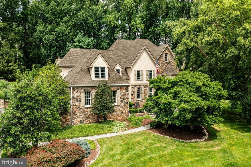 Welcome to 90 Indian Spring Road – your private summer sanctuary in the heart of Media’s highly desirable Indian Spring community!  Tucked away at the end of a peaceful cul-de-sac, this stunning 5-bedroom, 4 full and 2 half bath custom-built Colonial offers luxurious living and exceptional entertaining space on a beautifully landscaped 1-acre lot—complete with public water, public sewer, and a gorgeous in-ground heated pool.  Step inside the two-story center hall foyer and you'll be greeted by timeless elegance and modern updates throughout. The sunken living room with gleaming hardwood floors and a cozy gas fireplace creates an inviting space for gatherings, while the light-filled home office is framed by large windows offering serene views. The formal dining room features classic crown molding and wainscoting, perfect for hosting special occasions.  The gourmet kitchen is a chef’s dream, showcasing custom cherry cabinetry, a large center island,  Viking stainless appliances, double ovens, a Sub-Zero refrigerator, and a  butler’s pantry with extra cabinetry, prep sink, and floor-to-ceiling Sub-Zero wine fridge.  Adjacent is a bright breakfast area and built-in workstation, with access to the expansive Trex deck—ideal for indoor/outdoor entertaining.  The spacious family room boasts a vaulted ceiling, hardwood floors, dramatic window design, gas fireplace, and French doors leading to the deck.  The luxurious primary suite offers a peaceful retreat with a sitting area, dual California Closets, and an updated en-suite bath featuring a double vanity, jetted soaking tub, and oversized tiled shower. Four additional bedrooms include two updated hall baths with high-end finishes.  A separate back hallway provides access to a private bedroom suite with its own full bath—perfect for guests, in-laws, or an au pair.  The finished walk-out lower level includes a sixth bedroom, full bath, multiple recreation areas for media, games, or fitness, and an additional butler’s area—ideal for poolside entertaining.  Outside, the professionally landscaped fully fenced backyard is a true oasis, with stone walkways, a spacious deck and lush surroundings. A 4-car garage, walk-up attic,  whole house generator and countless custom details complete this exceptional home.  Enjoy the award-winning Rose Tree Media School District proximity to top private schools, and quick access to Newtown Square, downtown Media’s restaurants and events, and major routes including 476, I-95, and the Philadelphia Airport. This exceptional property is the perfect blend of comfort, elegance, and functionality—schedule your private tour today!