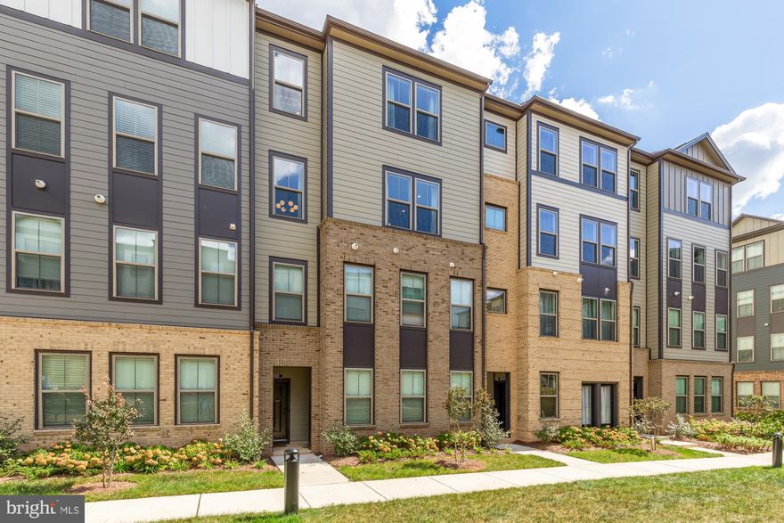 Skip the long waits, walkthroughs, and builder headaches, this residence is move-in ready NOW and already enhanced with nearly $50,000 in designer upgrades. Welcome to this striking two-story, townhouse-style penthouse residence that perfectly blends modern luxury with everyday convenience. Offering three spacious bedrooms, two and a half bathrooms, and a versatile den ideal for a home office or fitness space, the sought-after Hepburn model even features a private driveway, garage, and a covered rear terrace for effortless outdoor living.

The chef-inspired kitchen features upgraded stainless steel appliances, Sonoma Painted Linen cabinetry, satin brass hardware, quartz countertops in Iced White, a designer backsplash, double wall oven, gas cooktop, and a generous walk-in pantry. The expansive open-concept main level with soaring ceilings and flooded with natural light invites seamless entertaining, while wide-plank Cheyenne Rock flooring adds both style and durability.

The upper level primary suite is complete with a huge walk-in closet and spa-like en suite bath featuring a luxurious walk-in shower with seating. A full-size laundry room on the bedroom level further enhances convenience, ensuring comfort and functionality at every turn.

This home is was built as an Energy Series READY home. These homes are ENERGY STAR® certified, Indoor airPLUS qualified and, according to the DOE, designed to be 40-50% more efficient than the typical new home, saving you money.  

Conveniently located near Routes 7 and 28, this home is just minutes from grocery stores, dining, shopping, recreation, and Dulles Airport. Residents also enjoy community amenities including a sports court and dog park, offering the perfect balance of comfort, convenience, and lifestyle.  Tour today!