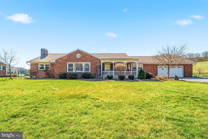 Welcome to this beautifully maintained brick rancher set on a picturesque lot with sweeping countryside views in Manchester, MD. This spacious home offers the perfect blend of comfort, functionality, and charm, all on one level. Step inside to a bright and inviting living room featuring gleaming hardwood floors, abundant natural light, and ample space for entertaining. The updated kitchen is equipped with stainless steel appliances, ample cabinetry, and a stylish backsplash, opening to a cozy dining area ideal for everyday living.
The home offers generously sized bedrooms, including a well-appointed primary suite with serene views. A tastefully updated bathroom features modern finishes and thoughtful design. A versatile bonus room provides the perfect space for a home office, playroom, or flex space to fit your needs. Downstairs, enjoy a finished lower level complete with a custom bar area—perfect for entertaining or relaxing—along with additional living space. Outside, the expansive yard offers endless possibilities with scenic farmland views, ideal for outdoor gatherings, gardening, or simply enjoying the peaceful setting. The attached garage and ample driveway parking add to the home’s convenience. This move-in ready property combines rural tranquility with easy access to local amenities—don’t miss your opportunity to call it home!