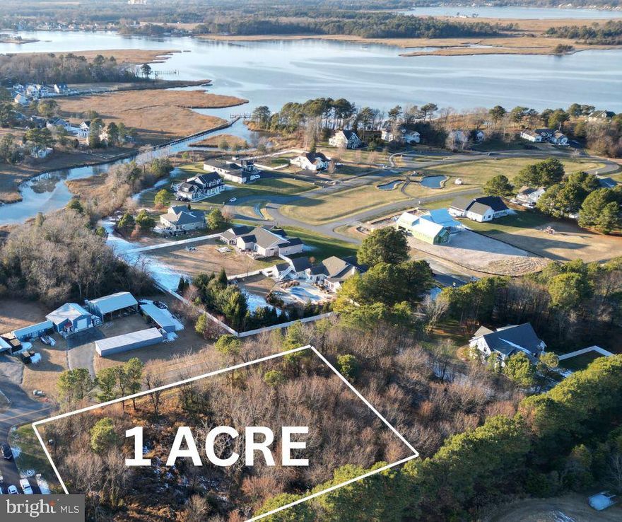 This One Acre lot is located in an exclusive waterfront community with dock access to the Indian River Bay. Enjoy fishing, crabbing, and so much more. The community offers a marina with a shared dock. There are currently no boat slips available for sale. Build your Dream Home or Buy and Hold as a SUPERIOR INVESTMENT.  There is a recent site evaluation and survey available upon request. In addition community restrictions are also available.