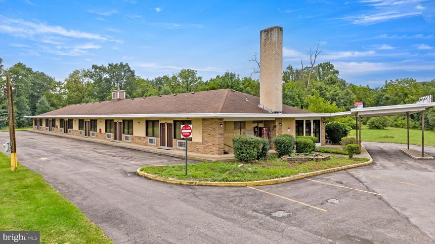 Now available: The Allenwood Motel, an operating 22-room, single-story hospitality property situated on approximately 5.5± acres in South Whitehall Township. Located at the end of a cul-de-sac just off the Route 22 interchange, this site offers rare flexibility for both ongoing operations and long-term commercial redevelopment. Zoned IC-1 (Industrial Commercial), the parcel supports a broad range of by-right uses including hotels, medical offices, flex industrial, retail, and mixed-use commercial development. The zoning allows building heights up to 70 feet, and with full access to public water and sewer, the property is well-positioned for vertical expansion or site redevelopment. The current motel structure spans approximately 8,440 square feet and benefits from over 450 feet of frontage. While set back on a quiet cul-de-sac, the property remains highly accessible—minutes from I-78, Route 309, Lehigh Valley Hospital–Cedar Crest, and Dorney Park. Route 22 nearby sees estimated traffic volumes of over 80,000 vehicles per day. This listing presents a unique opportunity to continue operating the existing motel, explore adaptive reuse, or reposition the site entirely for a higher and better use in one of the Lehigh Valley’s most connected commercial corridors.