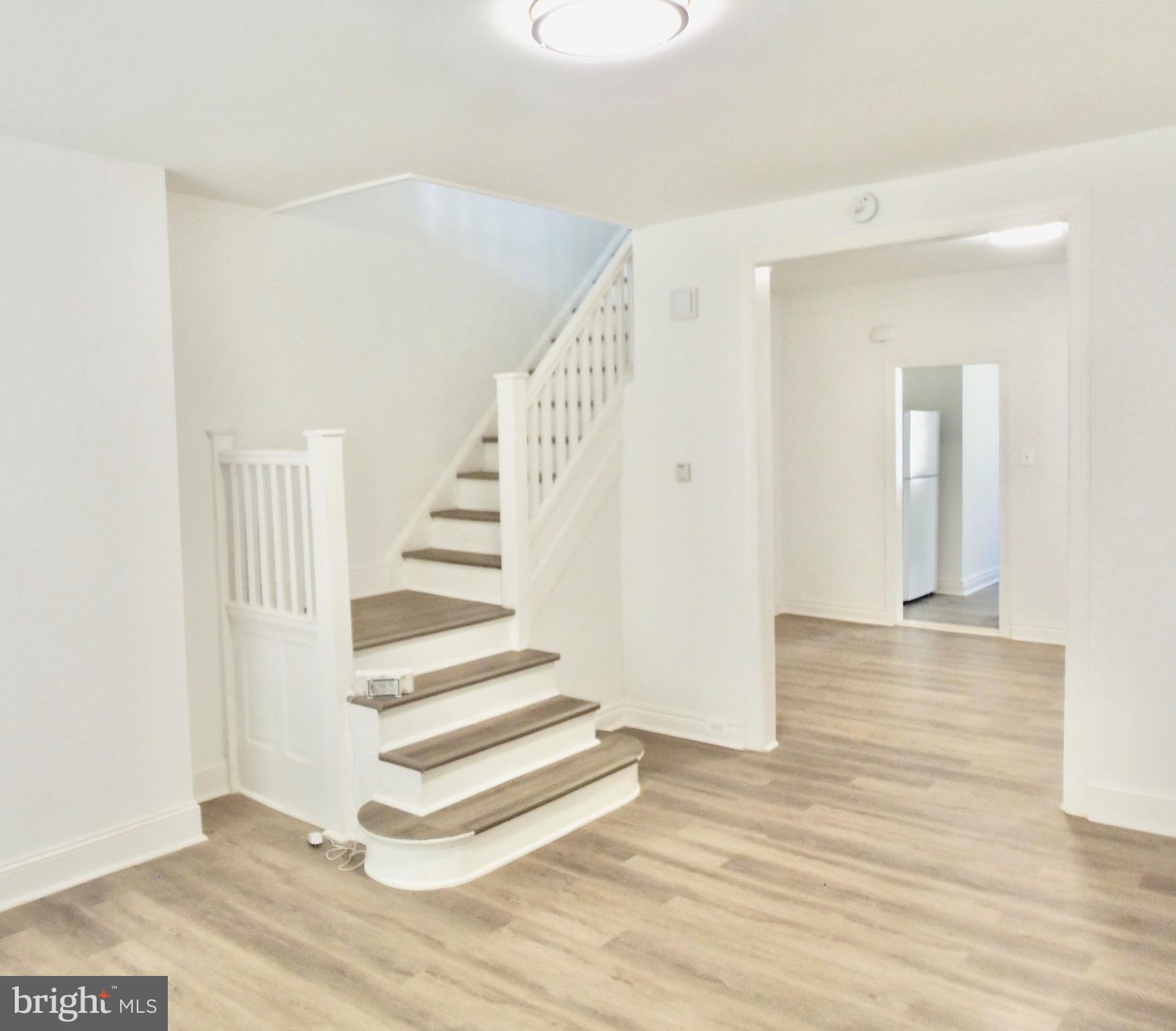 This newly renovated rental offers spacious rooms, high ceilings, and a bright, open feel throughout. Enjoy the elegance of granite countertops and beautiful matching floors that flow seamlessly from room to room. The home features a quaint backyard perfect for relaxing or entertaining, along with a large unfinished basement that provides ample storage or flexible use. Thoughtfully updated and full of natural light, this property blends comfort with modern style. This is a must see, as photos doesn’t do it justice!
