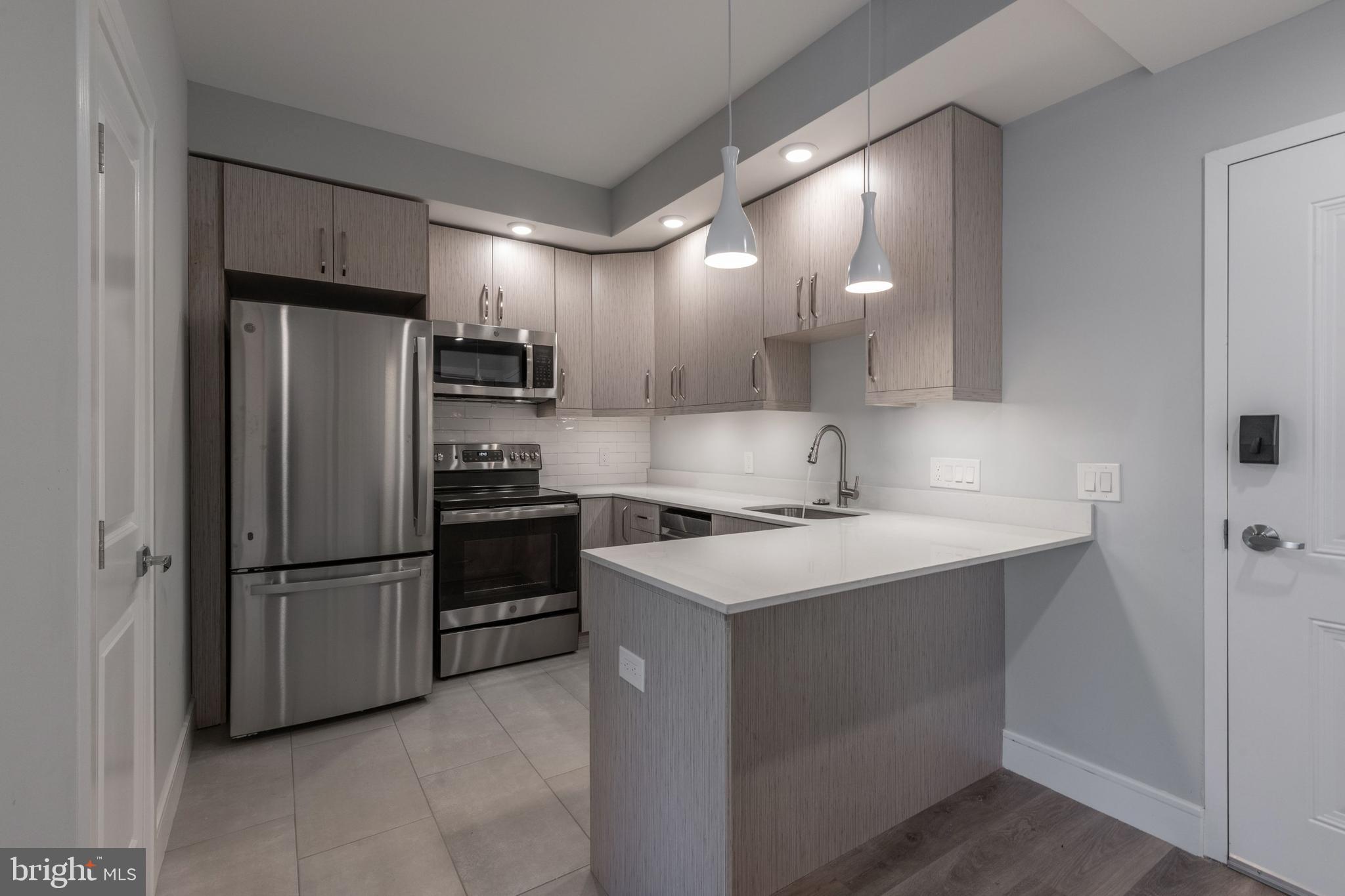 Welcome to 1222 Marshall Street, a recently constructed 4-story apartment building housing 20 stunning units boasting contemporary designs and finishes. Select from six unique floorplans, featuring 1 and 2-bedroom layouts, complete with private balconies, roof decks, and rear yards. Each apartment comes equipped with in-unit laundry, central air and heat, modern vinyl flooring, natural stone countertops, upgraded appliances, designer finishes, and even includes access to an on-site dog park!