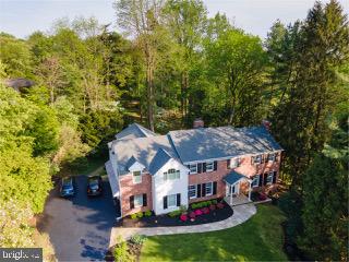 Gorgeous home on a cul-de-sac street in Green Country, one of Radnor Township's most coveted neighborhoods. This amazing 5BR /4.1BA home awaits you with park-like rear yard awaits you! A major renovation to this stunning home was completed in 2005. The expanded gourmet kitchen and morning room are the heart of this home with custom Woodcraft cabinets with Viking Professional, Miele, and Sub-Zero appliances. Designer subway tile backsplash with upgraded granite countertops. Every convenience for the experienced cook is available in this gourmet kitchen such as a pot filling faucet above the stove, a double oven with a warming drawer plus a vast amount of counter and island space perfect for food preparation as well as entertaining. Custom pantry and dry bar also in the kitchen with Marvel wine refrigerator. The breakfast room with a barn beam ceiling overlooks the tranquil rear yard and stone patio with natural gas direct connect grille. The breakfast area also has a two-station desk/homework area as well. A spacious mudroom with access to the driveway contains the separate laundry room, powder room, and closeted cubbie area as well as access to your oversized three-car garge. The formal dining room and living room are perfect for entertaining. There is a lovely wall of windows in the office that overlooks the scenic rear yard. The family room with a brick gas fireplace and custom built-ins also feature beamed ceiling accents. The main level of this home both inside and outside offers a wonderful floorplan while entertaining. Beautiful accents throughout this home including custom millwork, ample storage offerings, and designer touches at every turn. Just move in and enjoy this amazing freshly painted home with recently refinished beautiful hardwood floors. The second level features 5 spacious bedrooms with all actually on the second level. There is a newer primary bedroom suite as well as the original updated primary bedroom suite. The newer primary bedroom features a large walk-in closet, tray ceiling, dressing area, and spa-like bath with Jacuzzi tub, large shower, private toilet room, and large vanity. The original primary bedroom also has an en suite bathroom as well. The other three bedrooms and hall bath are of a very good size as well. The finished daylight, walkout lower level with full bath as well as a storage/utility room offers many options such as a great room, au pair or in law suite, or an office/studio. The roof was replaced in 2019. Never worry about losing power again with the whole house generator. There are three HVAC zones as well as a NEST programmable thermostat system. This Mainline home offers you the suburban lifestyle yet you are only a few minutes to the train in Bryn Mawr to New York City or Philadelphia. Close to all major local highways such as Rt. 495 and Rt. 95 as well as the Philadelphia Airport. Close to Whole Foods, fine restaurants, and shopping. Near great private schools as well as the highly-rated Radnor School District. Pre-listing home inspection completed in June 2022. One-year home warranty included. See Matterport virtual tour.