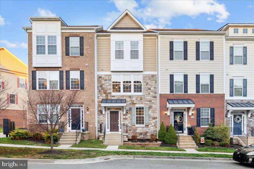 PRICED $5,000 BELOW THE PREVIOUS VA APPRAISAL! Buyers loss is your gain! Stunning Townhome in Market Square, w/ two-car detached garage and all the upgrades you can imagine! As you approach you are struck by the superior elevation, great curb appeal and grand feel. Enter to beautiful engineered hardwoods throughout the lower level making a very inviting entrance. The entry level is exceptional with large rec room for entertaining, high ceilings,  integrated surround sound system and custom barn style door, full bath and full bedroom. Walk-out to the rear patio, back yard and garage from this level. Main level is bright, open and luxurious. It features engineered hardwood floors throughout and a large kitchen island. The focal point of the main level is the gourmet kitchen with stainless appliances, beautiful granite counters and ample cabinetry. Main level has a formal dining, family room, powder room and ease of access to the rear deck. Large rear deck is spacious, maintenance free with composite material, along with a fully fenced in yard offering peace and privacy! Upstairs has three bedrooms including an exceptional primary suite. The primary suite has vaulted ceilings, walk-in closet, and en-suite bath. Two additional bedrooms upstairs supported by hall bath. Laundry room is upstairs for unparalleled convenience. Other features include an incredible rear garage that supports two cars and has ample storage. Enjoy this lovely location in Market Square which is walkable to the community pool, tot lots, Wegman's, shopping and dining. Ease of access to Route 26, Route 15 and 270. Just a short drive or bike ride to downtown Frederick and all it has to offer. This home is an absolute must see! Welcome home!