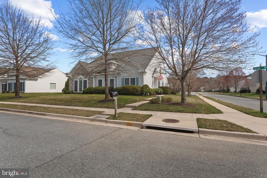 This large and stately Hillsboro model is set on a corner lot and offers expansive and open living space. The bright gourmet kitchen features stainless appliances and granite counters with the "Morning Room" extension that is great for either a cozy sitting area or a casual dining area. Open to the family room, this layout offers comfortable living and entertaining with soaring ceilings, a gas fireplace, and a bank of windows overlooking the private patio. Wood floors flow into the spacious and elegant living room with tons of light and formal dining space that will accommodate a large family gathering. Glass doors off the entry hall open to a large private library/office for quiet reading, studying, or business; some owners use this as a fourth bedroom! The large private primary suite features a walk-in closet and a large ensuite bath with a soaker tub and walk-in shower. The first-floor guest room and second bathroom are tucked off of the living area. Tons of closets throughout... so no need to worry about downsizing! A second guest bedroom and bath are on the second floor along with a spacious carpeted loft area that is perfect for an office, secondary TV watching, and/or a playroom for the grandkids. The spacious two-car garage features a convenient automatic door opener with a remote. The patio features a brick surround and plenty of space for outdoor entertaining. The Easton Club East community clubhouse features dances and movies, and is home to a fitness center, billiards room, a library, a card room, and arts and crafts room. For more active pursuits, there are tennis/pickleball courts, horseshoe pits, a putting green, walking paths and multiple ponds. Easton is just a few miles away offering upscale restaurants, boutiques, art galleries and entertainment at the Avalon Theatre. Medical facilities are nearby. Easton is accessible to Annapolis, BWI Airport, and the MD/Delaware beaches.