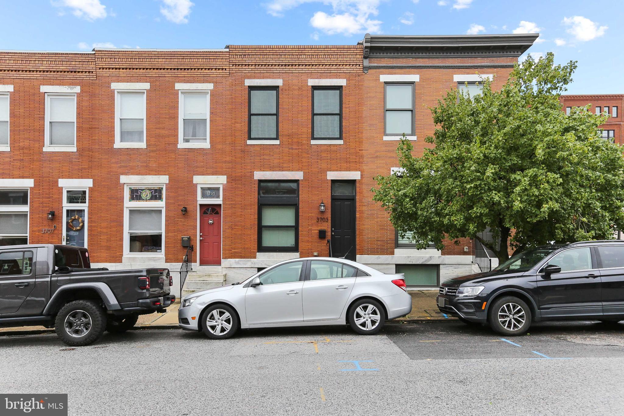 CHAP TAX CREDIT RENOVATION W/ PARKING & ROOF TOP DECK - this 14' wide renovation in convenient Brewer's Hill location features an open floor plan w/ hardwood floors throughout, island kitchen w/ granite counters, custom cabinetry, ss appliances, crown molding and exposed brick. Upper level offers large owner suite w/ luxurious bath, hallway laundry & second full bath, rear bedroom w/ walk in closet leading to two tier roof top deck. There is a fully finished lower level with two additional bedrooms and walk out basement. Approximately 4 years remaining on chap tax credit - current taxes only $3253/year with credit!