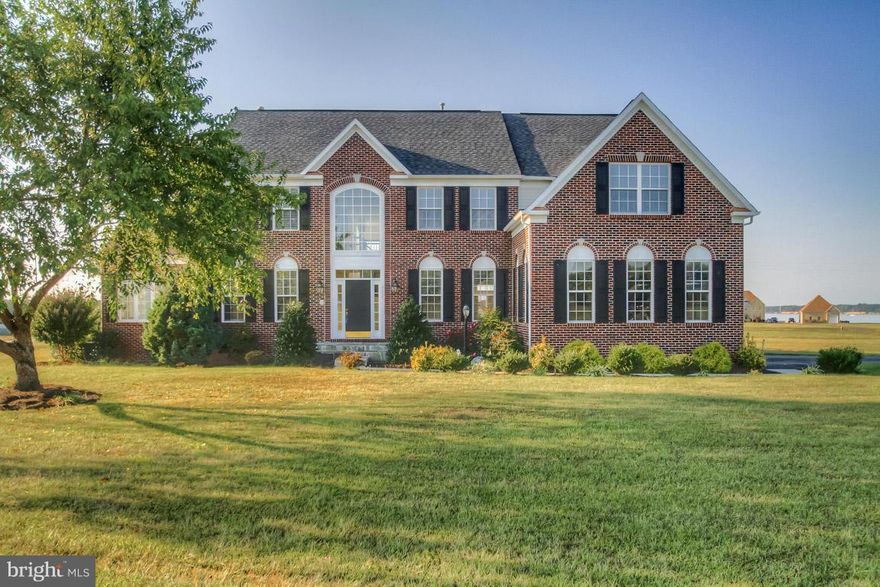 Enjoy living in this  beautiful Potomac River community. Boasting  a dramatic two story family room, rear sun room, side solarium, skylights allowing lots of natural light and an over-sized  owner's suite.  This is  complimented with upscale finishes such as granite, SS appliances, hardwood floors and  ceramic tile.  With views of the river from your back deck, this is a place for relaxing.