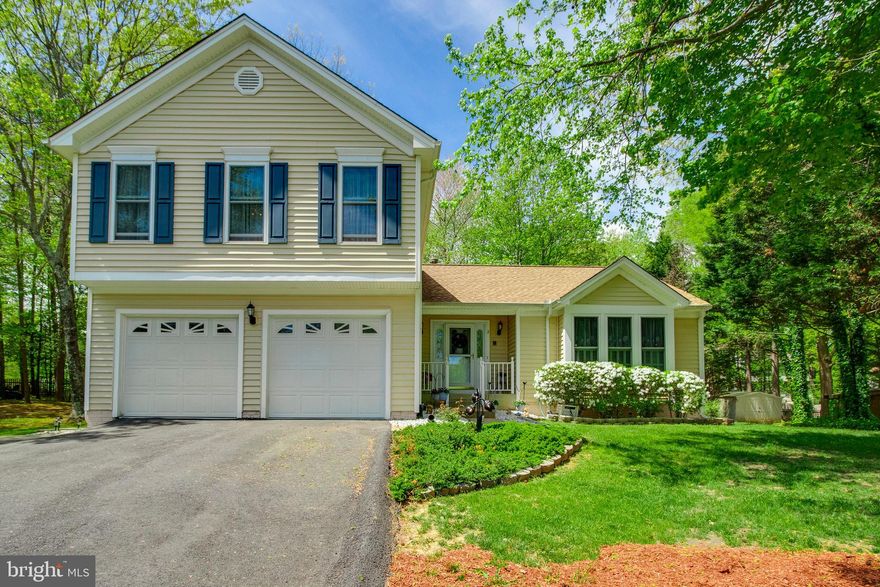 Looking for a worry-free, move-in ready home? This is it! You will love this immaculate, well-maintained, one-owner home. Hardwood floors throughout main level. Open & spacious kitchen with plenty of storage, pantry, granite counters, beautiful backsplash, & island too! Master Suite is HUGE and features his-and-her walk-in closets as well as nicely updated bath with double sink vanity and separate soaking tub. Enjoy nature & sunshine all year long - absolutley breathtaking 12'x16' four-season room addition! Spacious family room is light-filled and has gas fireplace to cozy up to on chilly nights. Backyard is a paradise with stamped concrete patio & wood deck too. Other updates & upgrades include: brand new garage doors & openers, brand new generator, nearly new roof, & nearly new heat pump. All this on a quiet cul-de-sac, plus no HOA! This one is a must see, don't let it get away!