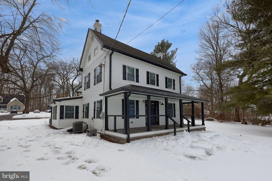 Move right into this beautifully updated home, renovated in 2023 with modern fixtures and finishes throughout. Situated on over 1 acre, the property also includes an oversized storage shed with a bay door—ideal for equipment, hobbies, or extra storage. The main level features a convenient first-floor bedroom and full bath—ideal for guests or one-floor living. The kitchen is the heart of the home, complete with a center island, quartz countertops, and stainless steel appliances, all overlooking the formal dining room for easy entertaining. Just beyond, the living room is highlighted by a sleek modern electric fireplace, creating a warm and inviting focal point. Upstairs, you’ll find three nicely sized bedrooms and a full bath with a walk-in shower. The finished attic provides additional living space and could easily serve as another bedroom, home office, or bonus room. The lower level offers abundant storage space to keep everything organized. Enjoy outdoor living with a patio perfect for relaxing or entertaining, along with a balcony featuring maintenance-free decking.