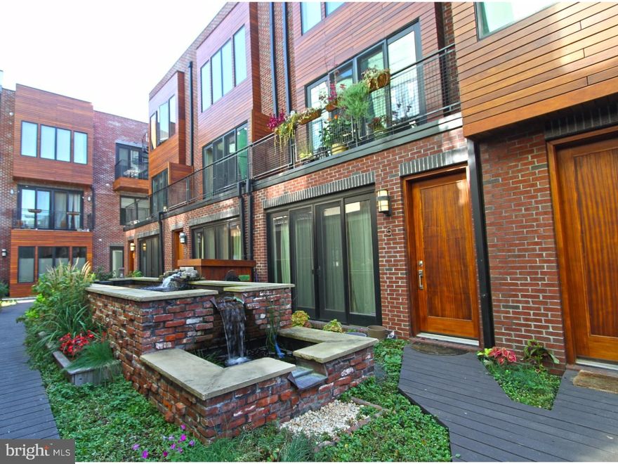 This spectacular Ice House phase 1, 2 bedroom, bi-level, 1.5 bath unit offers a large Private Green Roof and one car garage parking! Interior features include field finished oak hardwood floors throughout, recessed lights in LR, stunning floating steel stairs, large casement windows, custom kitchen with Energy Star stainless appliances, Quartz Counter tops and a large island with seating, flat panel bamboo cabinetry, stainless under mount sink with goose neck chef's faucet, pendant lighting, and stunning back splash. There is a balcony with tiled threshold overlooking the Koi pond in the living room. There is a convenient half bath on the 1st floor, along with a front loaded full size washer and dryer on the 2nd floor. The 2nd floor has 2 spacious sun filled bedrooms and ample closet space. The large bath has a dual floating vanity, basin sink, and a soaking tub beautifully tiled. Access to the large private Green Roof is from the 2nd floor guest bedroom. The common grounds are equally impressive and include a common green roof, planters throughout and a deck level Koi pond maintained by the property's rain water recycling system. Other common spaces to enjoy are the Ball Park over look, roof deck with seating, outdoor kitchen, and a rooftop Dog Park and sun deck. Located in walking distance to everything. The Frankford Arts and Girard Ave corridors have tons to offer including cafes, shopping, fitness, restaurants, and galleries. Garage parking spaces are valued at 20K and this one is included with the price of the unit. This phase 1 resale has approximately 4 years remaining on the tax abatement. VA approved!
