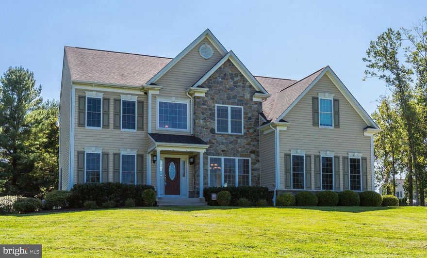 Designed and built to satisfy the buyer looking for all the modern amenities! This stately 5-bedroom stone colonial offers it all.  The soaring two-story foyer sets the grand entrance to an open floorplan boasting a living room, formal dining room with tray ceiling and decorative moldings and main-level bedroom or possible library.  The huge kitchen with breakfast room, granite countertops and stainless steel appliances opens to multiple inviting sitting areas: a sun room, breakfast room and family room enhanced by natural gas fireplace, walls of windows, and soaring ceilings.  The main home also presents butler’s pantry to meet every entertaining requirement.  Private level living offers a primary bedroom with two sitting rooms and luxury private bath with 80 gallon soaking tub with sprayer, shower with dual shower head and 2 walk-in closets.  Three additional bedrooms, each with separate thermostat, and additional full bath complete this level.  The lower level is complete with recreation room, and offers versatility for an additional bedroom and home theater!  A composite deck and sprawling stone patio provide the perfect place to gather to tell stories, relax and entertain. Equipped with modern conveniences: 12kW solar panel system with battery back-up, whole house humidifier, high efficiency furnace (UV system available), upgraded media center, 80 gallon water heater, Savant whole home automation system, CAT6 ethernet, wired for audio system, central vacuum, landscape lighting, security system with panning camera and upgraded infrared illuminated camera, upgraded electrical system, & much more, you must experience this home!