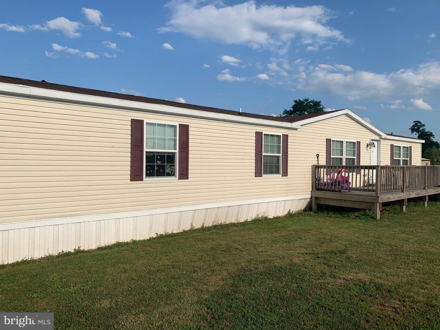 Beautiful double-wide manufactured home in Chesapeake Estates. With over 2,000 square feet of living space, this newer model offers you all the room you could need! Your new master bedroom with its en suite bathroom provides an oasis inside this spacious home, which is complemented by the large living room with a corner fireplace. The country setting of the park belies the convenience and amenities which are just a short drive away.  Come see for yourself why you should make this your home for the long haul!