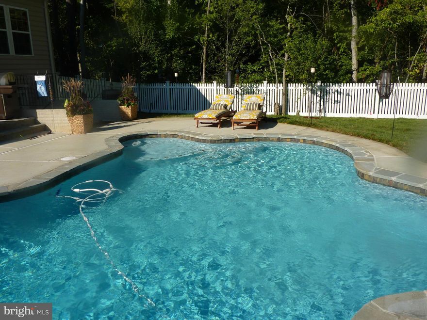Almost 4,000 finished sq. feet in this 4 yr. old home  Enjoy low maintenance Salt Water Heated Swimming Pool and vacation at home in your own back yard backyard. Trex deck, custom stone patio, LED lighting, vinyl fence, sprinkler system. Gourmet kitchen w/stainless appliances.,granite counters, sun room/breakfast area. Upstairs sitting room/loft.