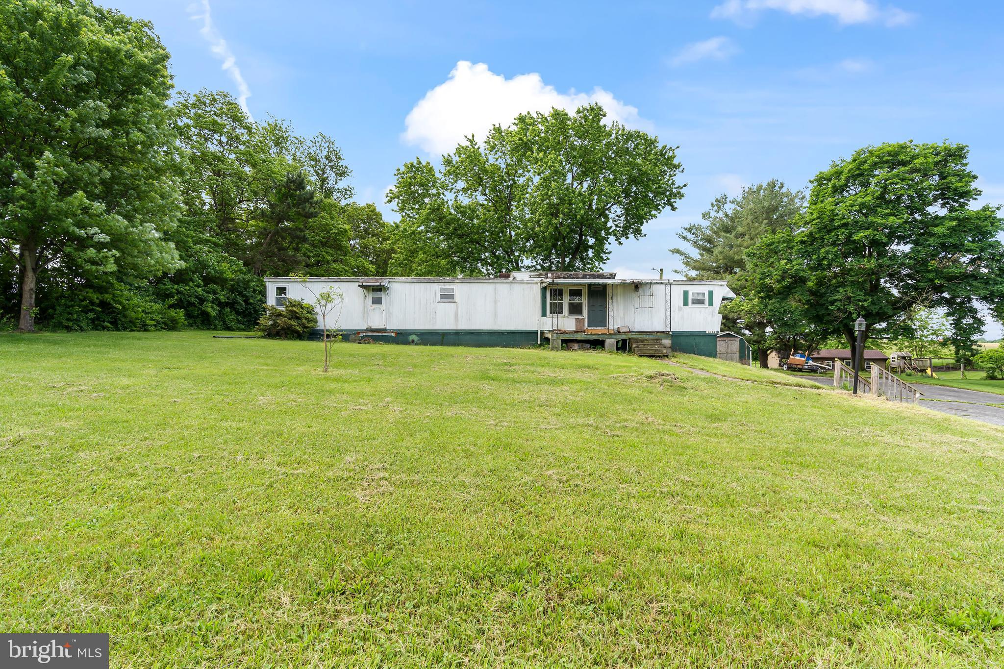 Remove the trailer and build your dream home on this beautiful land! Has existing block foundation and BAT septic was new in 2018. Being sold as is.