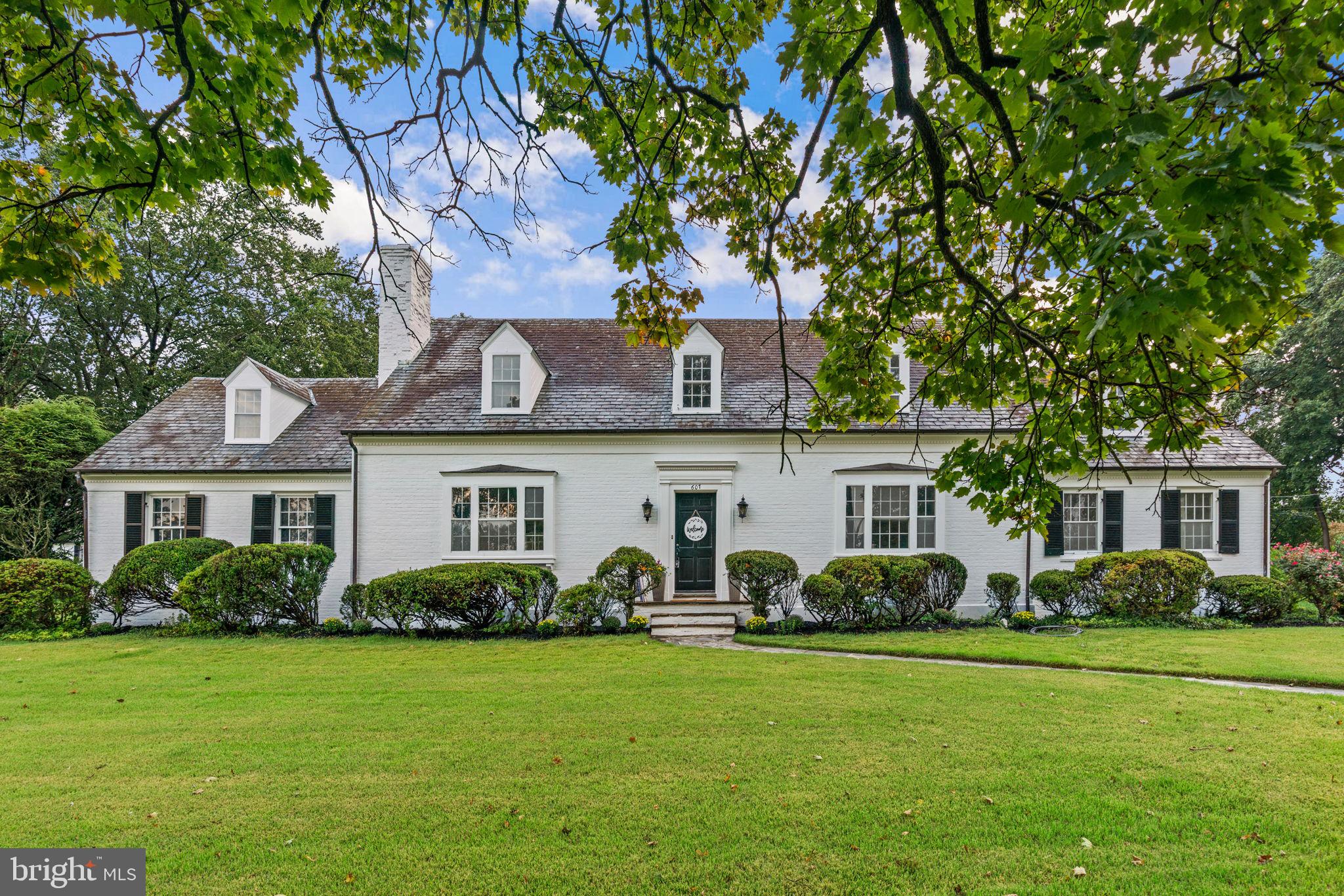 Welcome to 607 Hastings Road, a stunning residence in the highly sought-after Wiltondale community of Towson. With over 3,200 square feet above grade and more than 5,200 square feet in total, this home offers exceptional living space and timeless charm in one of Towson’s most desirable neighborhoods. The main level features a gracious living room with fireplace, a formal dining room with its own fireplace, a den with brand new carpet, and a spacious kitchen with adjoining breakfast room. Two bedrooms, a full bath, and a convenient half bath complete the first floor. Hardwood floors flow throughout most of the main and upper levels, with newly installed luxury vinyl plank flooring in the kitchen for both style and durability. Upstairs, you’ll find two spacious bedrooms, each with its own walk-in closet and full bath. One of the bedrooms also features a pass-through to an additional flexible room—ideal as a fifth bedroom, home office, nursery, or expansive custom closet. The lower level houses the laundry room and a large storage area, with an expansive open layout and walkout stairs to the backyard. This space is ready to be finished as a recreation room, media room, workout area, or even a sixth bedroom. Outdoors, enjoy a private stone patio off the rear of the home as well as a larger stone patio in the yard with a built-in fireplace—an ideal setting for gatherings and summer evenings. The attached two-car garage adds everyday convenience. Wiltondale residents enjoy access to the community pool and a location just moments from Towson High School, Towson University, and the shops and restaurants of downtown Towson. Don’t miss this rare opportunity to own a spacious home in one of Towson’s most established communities.
