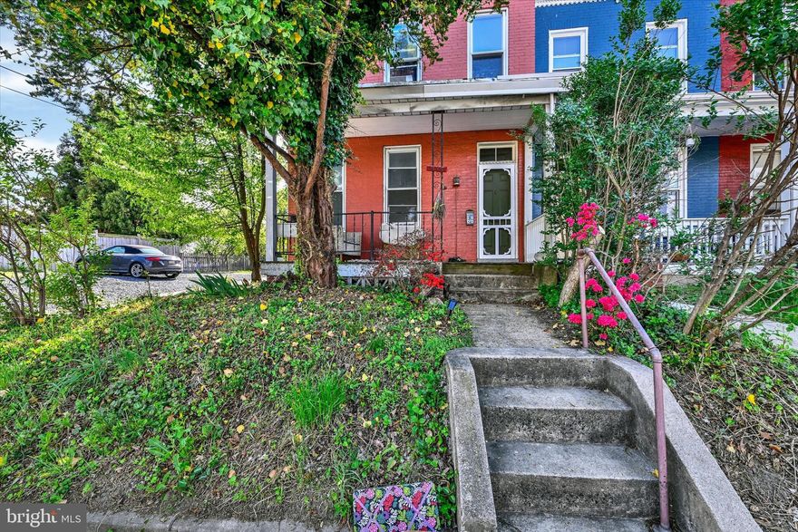 Historic Woodberry charm meets character and flexibility in this bright end-of-group home with southern exposure and abundant natural light throughout. One of the older homes in the neighborhood, it offers original details including hardwood floors, trim and doors, along with exposed brick and built-in bookcases.
The extra-wide layout provides generous living space, including a rare first-floor third bedroom or home office. Spacious eat-in kitchen with room to gather and entertain. Convenient second-floor laundry adds everyday ease. Bonus finished attic space offers additional flexibility for studio, playroom, or storage.
Stay comfortable year-round with Fujitsu mini-split system systems for cooling or supplemental heat alongside hot water radiator heat.
Outside, enjoy a courtyard tucked between the house and an expansive artist studio featuring a small wood stove—an inspiring retreat with endless possibilities.
