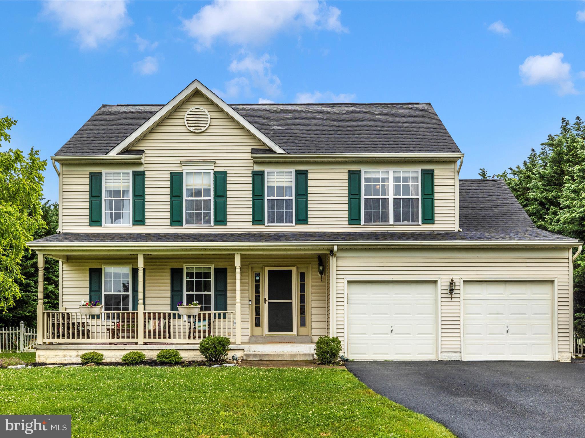 Welcome to 5880 Union Ridge Drive, a spacious colonial with an inviting front porch. Inside, the main level offers formal living and dining room spaces, while the kitchen opens to a cozy family room with a fireplace and a bright morning room that leads to a good-sized deck. The large, flat backyard is fully fenced and has plenty of room to add a pool. Upstairs, the primary suite features a generous walk-in closet and an ensuite bath with a soaking tub. Three additional bedrooms, a full bath with dual sinks, and a convenient laundry area complete the second level. The finished basement includes a half bath and flexible space for recreation, work, or storage.