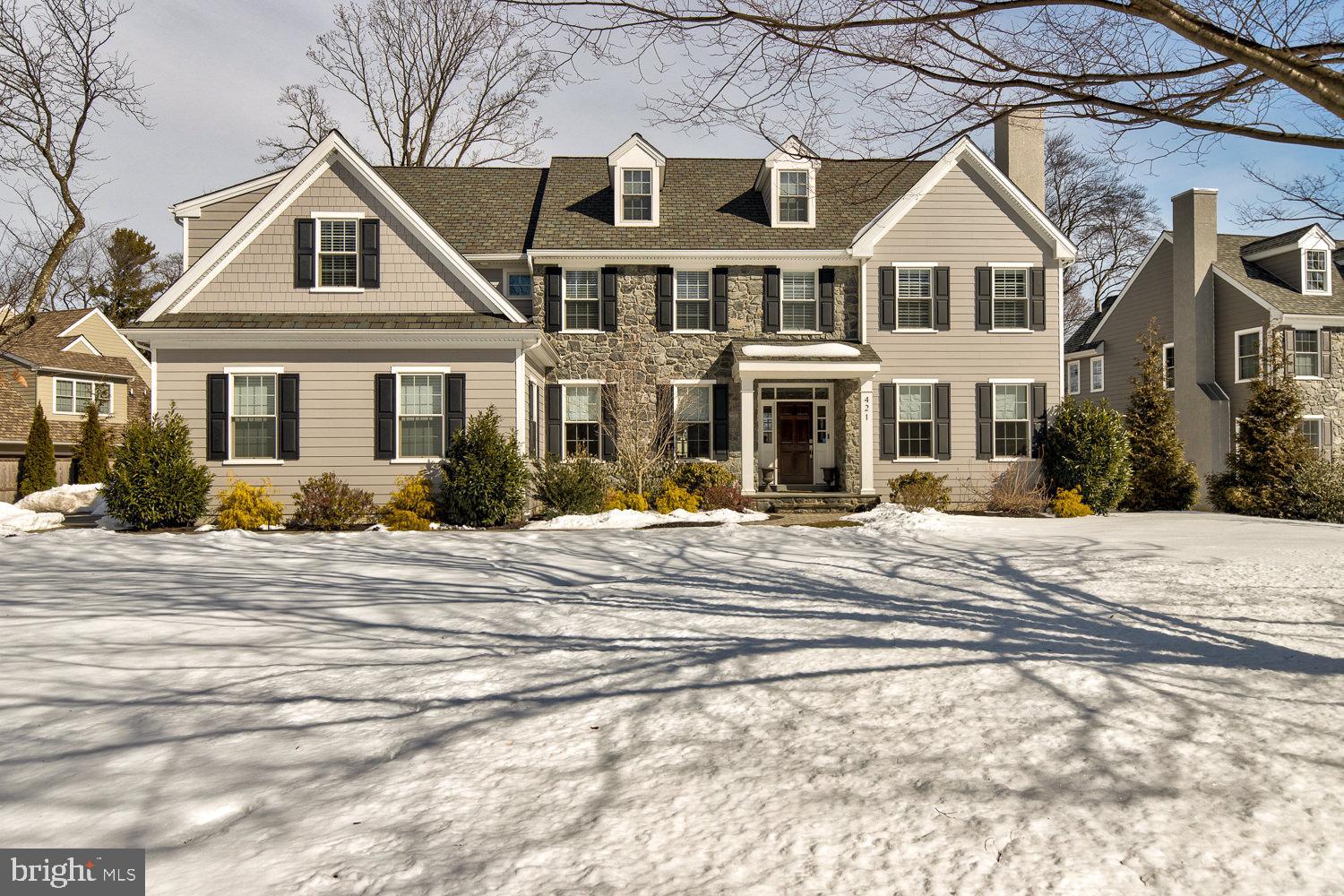 This home has been elevated from "new" to "better than new" to "perfection" by the present owner. It all starts with a great floor plan: Picture an entry hall with a wide opening to the living room on the right and dining room on the left. Walking on, you come to French doors leading to the rear of the property. The Living Room - along with other rooms throughout the house - has hardwood floors. Also, it has a fireplace, crown moulding, attractive wall sconces, and tasteful custom window treatment. Entering the wide opening to the Dining Room, custom wainscoting adds the finishing touch. The sunlit gourmet Kitchen is surrounded by large windows and an abundance of beautiful modern cabinetry in white and grey. The stainless steel appliances include a wall oven, microwave, six-burner cooktop, oversize sink, and super-sized refrigerator. The white quartz counters are complemented by a striking backsplash. Enjoy your snack, lunch, or dinner at the large island with spacious seating as you're bathed in overhead pendant lighting. Alternatively, you could choose to relax at your kitchen table with a serene view of your greenery. Adjacent to the kitchen is the Family Room with a fireplace surrounded by slate and bathed by light from a pair of large windows. The Family Room's windows have custom hidden motorized shades that operate independently of each other. The first floor has a private room that is currently shown as a bedroom. Alternatively, it could be the perfect spot for your study or office. In either case, there are pocket doors for privacy and an adjoining beautiful full bath. As you head to the side entrance, it would be unfair to call the space a mud room. Here you'll see hooks and cubbies with two hall closets: A place for your attractive side table leading to back stairs. There is also a powder room with pocket doors. On the second floor you'll notice great wall space for your artwork. At the top of the stairs is an eye-catching light fixture that enhances the opening. The Master Bedroom has a double-door opening to an alcove for privacy with ample wall space for furniture, two very large walk-in closets, and a very special Master Bath. This bathroom has a white soaking tub, a double vanity, large seamless door walk-in shower, and separate water closet. The second bedroom is large with a walk-in closet and adjoins a jack-and-jill bathroom. This white bathroom has a double vanity, custom glass doors for the bath/shower, and separate water closet. The third bedroom connects to the bathroom. The fourth bedroom is also large with a walk-in closet and adjoins a bath with another custom glass door and opens to the hall and fifth bedroom. The fifth bedroom is another sunny room and has two closets. The lower level is finished with wide open space. This room has ample ares for seating, entertaining and game space. If a home gym is your choice, there's room for that also. Every house needs storage. The basement and attic takes care of that. Now it's time to entertain. The outdoor patio located off the kitchen is private and is totally fenced with large evergreens at the far end and planted along the fence. The very attractive home is in excellent condition with upgraded finishes by the owner. Located on a cul-de-sac this location is walkable into Gladwyne Village and close to shopping and major roadways. **See the list of seller upgrades