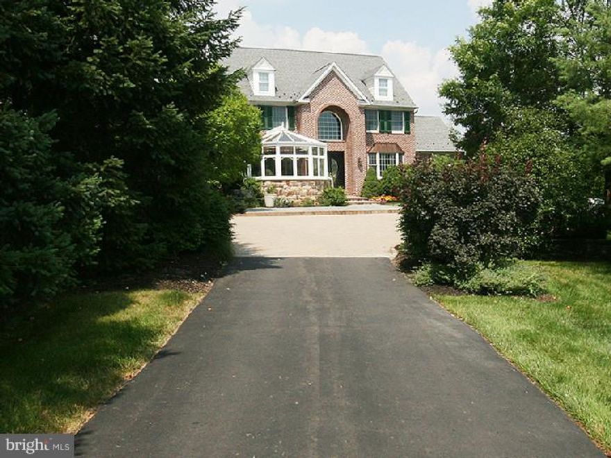 Approached by a long private drive, this custom-built estate home is perfectly nestled into its managable lot for complete privacy. Blending warmth with superior quality, this home was designed for entertaining. The exquisite outdoor living space features ingound pool with spa, outdoor kitchen, pool house with granite counters, refrigerators and bar. The rich mahogany deck and pergola is the perfect spot to enjoy intimate gatherings or large scale events. With rich millwork, moldings and details, the interior is high style, including a kitchen any chef would love, featuring Decor, Miele, Sub-Zero and Viking appliances, butler's workstation and breakfast bar. The lower level is uniquely accessed through a glass atrium and open stone stairwell, revealing a wet bar, gaming area, temp-controlled wine cellar and sauna. The large master suite includes a private bath, sitting/dressing areas, and bridge/loft leading to fitness room and oversized closet. Allow plenty of time to tour this very special home!