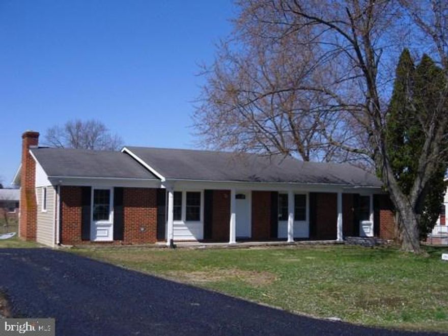 Lovingly Maintained Rambler with Great Curb Appeal. Sited on Symmetrical Lot with over 1/3rd Acres.  Partially Fenced Rear Yard. Numerous Updates throughout; Wheel Chair Accessible. Expansive Family Room features Brick Hearth, Wood Burning Fireplace. Upgraded Kitchen Includes Granite Countertops, New Stainless Steel Refrigerator, New Built-in Oven, and Double Sinks. New Laminate Wood Flooring in Dining Room, Living Room , Kitchen and Hallway. New Hot Water Heater. Recently installed Pella Windows, Doors, Screened-in Porch,  and Driveway. Remodeled Baths and fresh paint throughout. Turnkey, Ready for Immediate Occupancy.