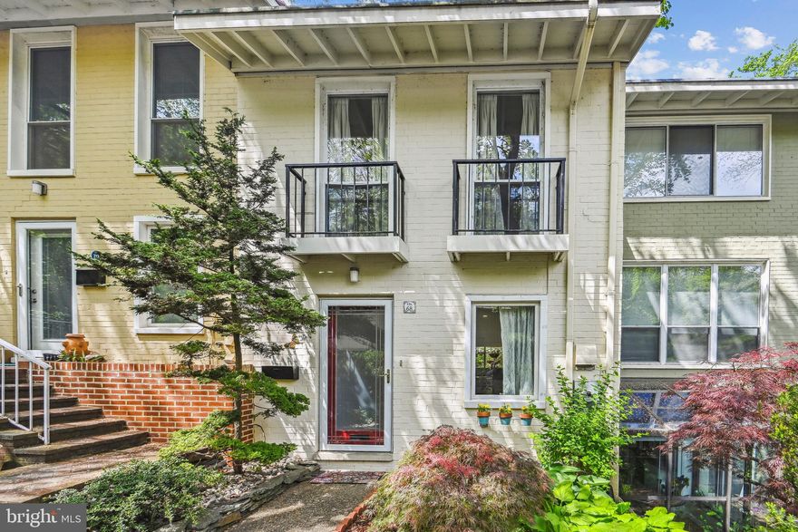 Reston living at its best! Fabulous mid-century modern townhome designed by Chloethiel Woodard Smith in one of Reston's original neighborhoods in the heart of the Lake Anne community. This 3-level Waterview Cluster townhome is a Gem! Nestled in a private strip of the "Sherbert Colored" homes, you have the luxury of living near the beach (follow the trail just beyond the rear of the home) with dock at Lake Anne. Seller is leaving you the 2-person Kayak stored at the dock. The kitchen features Luxury Gourmet Appliances sporting the Thermador brand, a pantry, and a breakfast bar that opens up into the Living/ Dining Combo. The living room with crown molding and recessed lighting, offers spacious built-in bookshelves and cabinets and beautiful wood floors! The sliding door leads you to a cozy 12' x 7' upper Trex Deck with amazing views of nature and woods. Below the deck is an elongated Trex patio that is 16' x 14' and provides amazing privacy and outdoor space. As a true added bonus, this townhome comes with an assigned carport with a 10' x 3' lockable storage closet. Extra parking is also plentiful. Upstairs features 2 generously large bedrooms and a full bathroom. Make sure you notice the very large windows and tall cathedral ceilings that provide great natural light and stunning architectural details! The lowest level dons a very large room with frosted glass doors that lead to the walkout Trex patio. This room with over a 9' ceiling, with a closet, can be used for a very large 3rd bedroom or recreation room. The laundry room with conveying washer and dryer boasts room for storage shelving, Electronic air filter, and new electrical fuse box with surge protector. To further provide you with plenty of storage, the attic located in the walk-in closet provides boards to be able to store anything and everything.  Air conditioning is on the Relac System. Seller uses Fios and it is excellent. Location Location Location! This is a commuter's  delight as it is within 2 miles of the Wiehle Ave Metro, and the W&OD Bike Trail and Reston Town Center! Live the Restontonian life like it was meant to be!