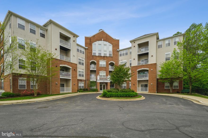 Beautiful two bedroom two bathroom Devereaux model condo in the sought-after 55+ condominium community of Village of Waugh Chapel West. This secure building has a lovely lobby that greets guests as they walk in. Two convenient elevators take guests to the third floor where a bright hallway leads the way to the corner condo. Inside the condo are 9” ceilings, a large laundry to the right, and a guest bedroom and bath with shower on the left. Straight ahead is the living room with a cozy faux fireplace. The kitchen is a delight with 42’’ cabinets and ample windows for light. Adjacent to the kitchen are the dining room and a sitting room, perfect for quiet relaxation with scenic views of trees and greenery. Next to the living room is a flex space currently used for an office, but would also be a perfect den for extra seating. The primary bedroom has two walk-in closets and a large bathroom with a double sink and separate tub and walk-in shower.. Condo comes with an underground assigned parking space. There is no need for a car once parked— the community is walking distance to shopping and restaurants. Come and visit this well maintained unit!