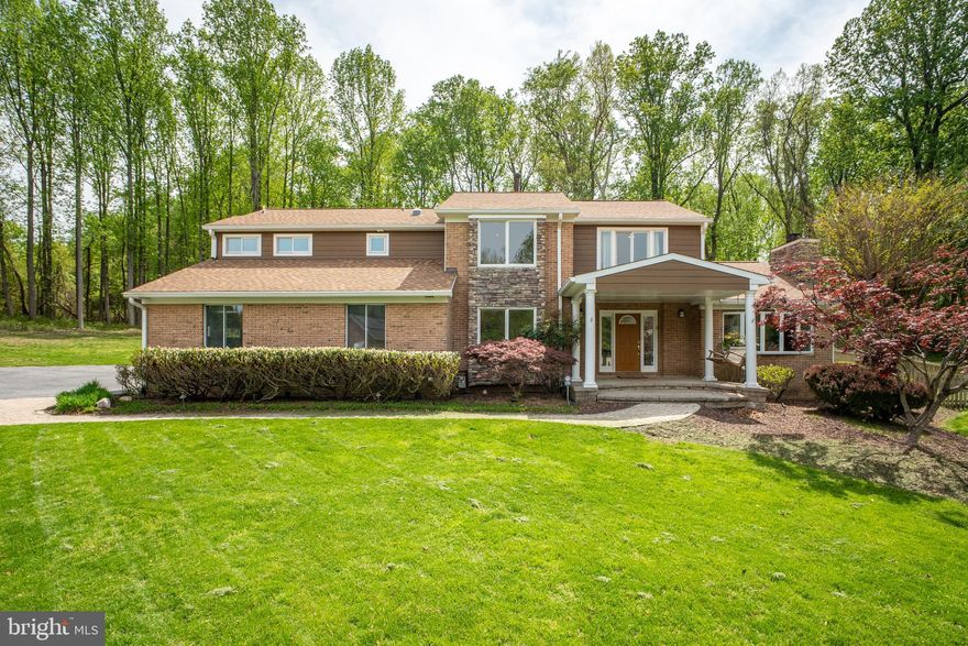 Stunning Sandy Spring-Built Craftsman Colonial on 2 Serene Acres:
Nestled on a peaceful cul-de-sac, this exquisite Craftsman Colonial boasts a prime 2-acre lot backing to mature trees and the scenic Falls Road Golf Course. Offering an exceptional blend of space, comfort, and natural beauty, this expansive home features 5 generously sized bedrooms and 4.5 baths, including a luxurious primary suite with a dressing room and updated bath, plus a lower-level guest suite.

Main Level Highlights:
-Inviting front porch sets the tone for this remarkable home.
-Chef’s dream kitchen (tastefully updated) features a Wolf cooktop, built-in microwave, stainless steel 
  appliances, custom cabinetry, pantry, granite countertops, an oversized sink, and a pass-through window 
  (2021) to the outdoor grill station (2024). A cozy gas fireplace adds warmth and charm.
-Spacious island, breakfast room, and wet bar with a mini fridge, instant hot water, and ice machine for 
  added convenience.
-Vaulted ceiling family room with walls of windows framing tranquil views.
-Elegant formal dining room and inviting living room with a striking stone fireplace—perfect for 
  entertaining.
-Dedicated office and private study ideal for remote work.

Upper-Level Retreat:
-Sun-filled primary suite with skylights, a dressing room, and a beautifully updated bath.
-Additional bedrooms and a dual-entry bath with skylights for natural light.
-Beautiful and large balcony overlooking lush green open spaces which is directly accessible by multiple 
  bedrooms.

Lower-Level Luxury:
Thoughtfully updated with luxury vinyl flooring, a renovated full bath (2020), Ela storage system, workshop, and a private guest suite.

Outdoor Oasis:
-New outdoor kitchen (2024), two-tier deck, fire pit, and a gazebo with a hot tub—ideal for relaxation and 
  entertaining.
-Fenced side yard and electric dog fence for pet safety.
-3-car garage with workshop space, plus a mudroom featuring custom-built cubbies, storage, and a utility sink.

Recent Upgrades:
-Hot water heaters (2023)
-Zoned HVAC with dehumidifiers (2020 & 2024)
-Roof (2023)
-New hardwood floors throughout the 2nd floor (2025)
-Fresh paint on 1st and 2nd floors (2025)
-2nd floor and lower-level new energy efficient LED recess lights throughout. (2025)

Located in a top-rated school district with easy access to amenities, this luxury retreat offers the perfect blend of tranquility and convenience.