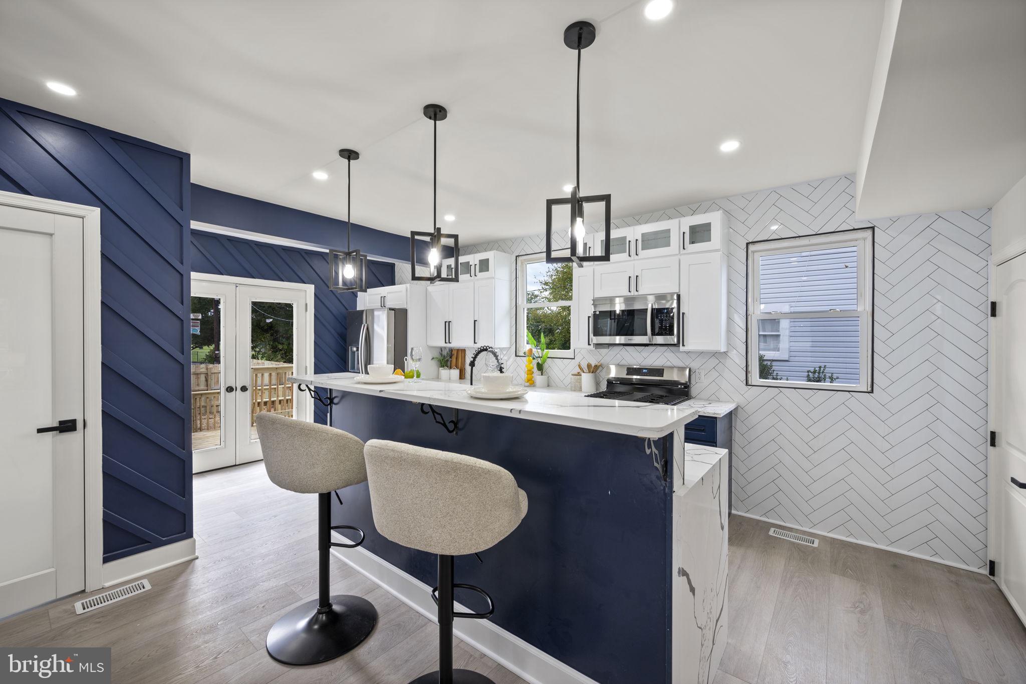 Welcome to 4307 Miami Pl, a beautifully renovated 4-bedroom, 3.5-bath home offering the perfect blend of style, space, and sophistication. Step inside this open-concept gem, where natural light pours through every room, highlighting the seamless flow and thoughtful design that make this home truly special. The spacious main level features a bright, airy open floor plan — perfect for entertaining or relaxing with family. The living area boasts sleek finishes, designer lighting, and large windows that fill the space with warmth and light. The gourmet kitchen is a showstopper with quartz countertops, custom two-tone cabinetry, modern tile backsplash, and high-end stainless steel appliances — a chef’s dream come true. Upstairs, the primary suite offers a private retreat complete with a luxurious en-suite bathroom and generous closet space. The additional bedrooms are equally inviting, providing comfort and versatility for family, guests, or a home office. The fully finished basement offers even more living space — including a bedroom and full bathroom, making it ideal for guests, in-laws, or an additional family suite. Enjoy the cozy electric fireplace feature wall that adds a modern touch and warmth to the lower level. Enjoy outdoor living on your deck overlooking a spacious fenced yard — ideal for summer barbecues or quiet evenings under the stars. A detached garage and private driveway add convenience and security. Located in a desirable neighborhood, this home offers easy access to shopping, dining, schools, and major highways, making it as practical as it is beautiful. Experience modern comfort, timeless design, and unbeatable value. 4307 Miami Pl is the home you’ve been waiting for!