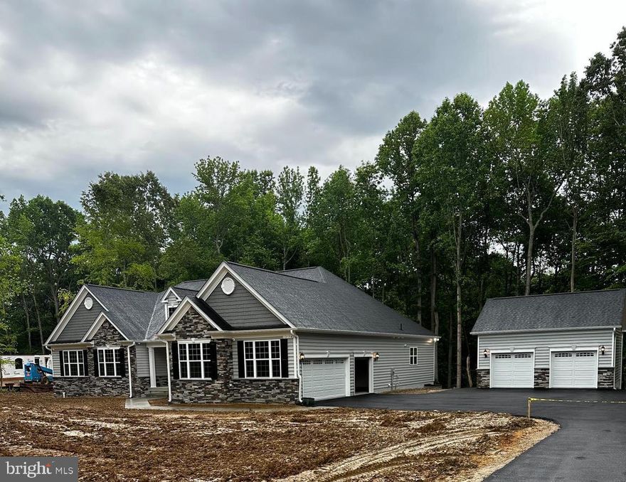 QBHI's popular Winchester floorplan with Stone, the D2 elevation with 4 bedrooms and 3.5 baths on the main level. Large owners suite with sitting area, full bath with deluxe shower and walk in closets. Sunroom off of the kitchen area has a deck that connects to the sitting area in owners suite. Large family room with coffered ceiling and gas fireplace, plus formal dining room. Basement level has huge recreation room, study and full bath. This beautiful home has a 3 car attached garage and 2 car detached garage. Call to build your dream QBHI home.