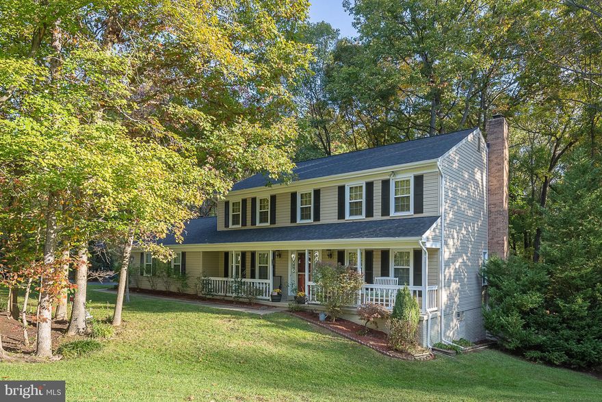 Elegant Colonial on a large treed fenced lot  5BR's 31/2 BA's All baths have updated Many upgrades newer vinyl siding,windows and  roof  Beautiful Maple hardwoods in Foyer LR, Dr&FR Huge kitchen with island, granite  8X8 breakfast area & bay window Cozy Fam Rm with  FP SGD's to decks & stairs to patio  Recently finished w/o basement w/ large rec rm 3rd full bath 5th BR not to code 2 car garage