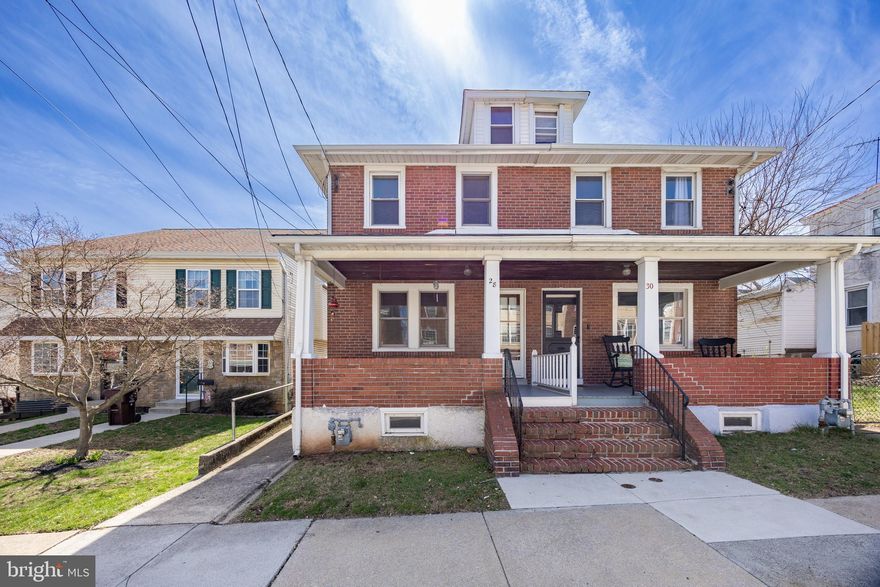 Solid Brick Twin in Bridgeport Borough with Off-Street Parking for Two Cars! This charming home features an inviting covered front porch, a spacious living room and dining room with hardwood floors beneath the carpet, and an updated eat-in kitchen with granite countertops, a tile floor and backsplash, a dishwasher, a gas range, and a built-in microwave. A convenient powder room and access to the rear yard complete the first floor. Upstairs, you'll find three generously sized bedrooms, all with ceiling fans, a tiled hall bath, and a walk-up attic with flooring for extra storage. The full basement includes a washer and dryer and a rear yard access door. Recent updates include a new roof (August 2020) and a new hot water heater (2017).