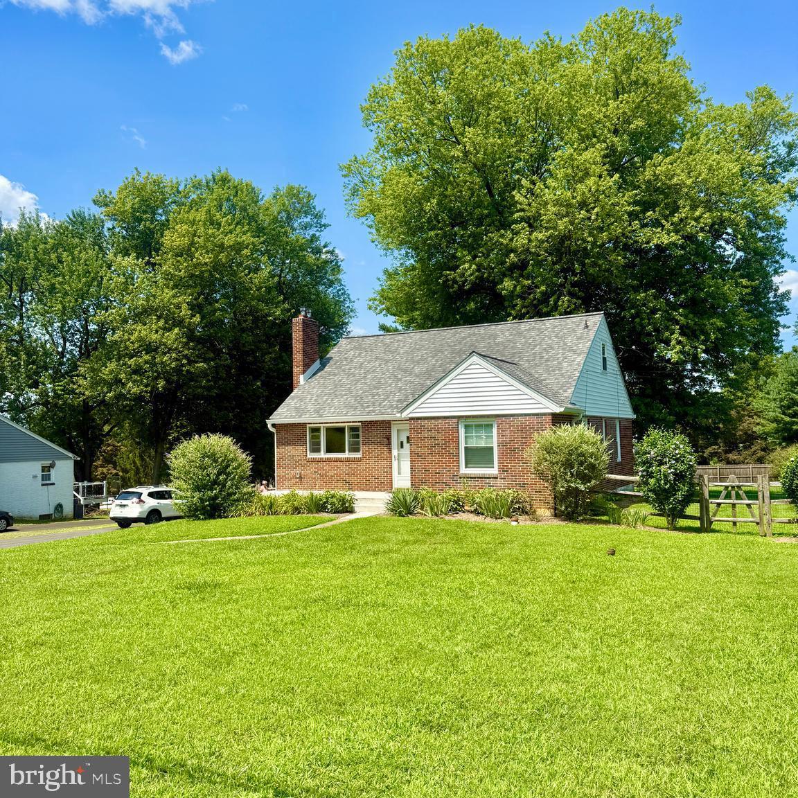 Welcome to 149 Hunt Lane in Phoenixville — a picture-perfect property tucked on a scenic, nearly half-acre lot. From the moment you arrive, you’ll be charmed by the lush landscaping and massive butterfly bushes that draw in colorful visitors, best enjoyed from your cozy front porch. The fenced-in backyard offers plenty of space for play or entertaining, complete with a shed, shaded seating area, and a mature tree that anchors the space with charm and privacy. Inside, the gourmet kitchen is a standout, featuring stainless steel appliances including a gas cooktop, double oven, dishwasher, microwave, and fridge — plus a window over the sink so you can take in the backyard views while doing dishes. The first floor has newly refinished hardwood floors, two spacious bedrooms, and a full bath, all freshly painted for a bright and welcoming feel. Upstairs, you'll find two additional rooms with new carpeting — perfect as bedrooms, or use one as a peaceful home office. This home is a true blend of nature, function, and comfort, all just minutes from downtown Phoenixville. Pet friendly too!!