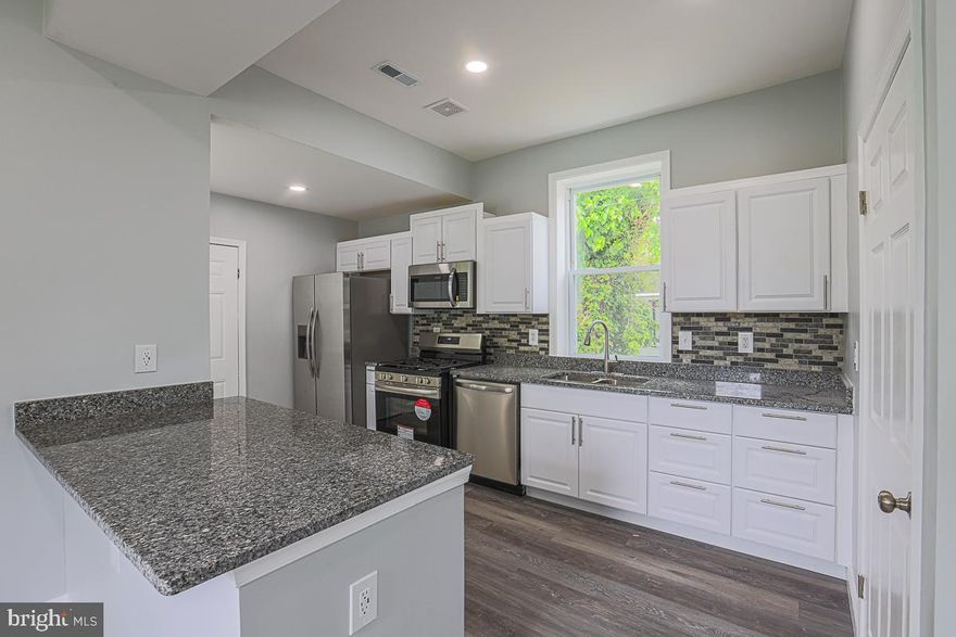 Welcome to 5216 Florence Avenue, Baltimore, MD 21215! Discover this beautifully renovated single-family home in the Arlington neighborhood of Baltimore City. This expansive residence offers 6 spacious bedrooms and 4.5 bathrooms across four finished levels, providing ample space for comfortable living. The main level features an open floor plan with a bright living area, a dining room, and a modern kitchen equipped with granite countertops, a kitchen peninsula, and stainless steel appliances. A convenient half bath with a double sink completes this level. The second floor includes three bedrooms and two full bathrooms, including a luxurious master suite with a custom tile shower. The third floor adds two more bedrooms and a full bathroom, while the fully finished basement offers a private bedroom, a full bathroom, and walkout access. 
Additional features include an enclosed front porch, a fully fenced backyard, and a driveway providing off-street parking for up to three vehicles. Recent updates encompass new flooring, electrical, plumbing, HVAC systems, and a new roof, ensuring a move-in-ready experience. Situated in a convenient location with easy access to local amenities, this home combines modern upgrades with classic charm. Don't miss the opportunity to make this exceptional property your new home.