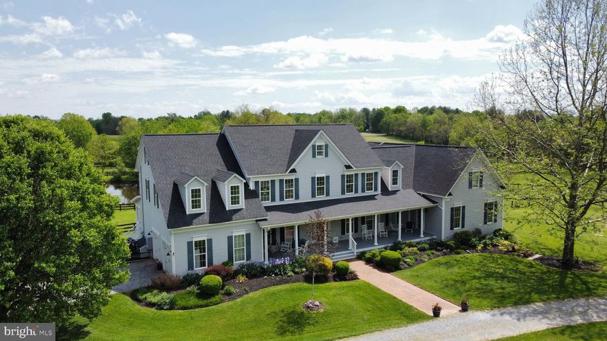 **OPEN HOUSE SUNDAY 5/18 2-4PM***10 Acre Private Estate perfect for multi-generational living featuring a stunning pond and Mountain Views!  Welcome to this breathtaking estate in scenic Lovettsville, Virginia—where space, style, and serenity come together on over 10 acres of picturesque countryside. Located just minutes from dining and shopping, this 7-bedroom, 6.5-bathroom residence offers over 6,300 square feet of living space across four finished levels, including a walk-out basement and FULLY SEPARATE LIVING QUARTERS featuring 2 bedrooms - 2 full baths - living room - full kitchen and laundry—ideal for multi-generational living or short-term rental income.  Set on 7.29 acres with a buildable 3-acre adjacent parcel included, this property features a private pond, black board fencing, a circular driveway, and sweeping mountain views—all the makings of a rare rural retreat.  The heart of the home is a beautifully updated kitchen with quartz countertops, new white cabinetry, and stainless steel appliances, flowing seamlessly into spacious living and entertaining areas. A recent addition provides a complete second living space with a full kitchen, living room with fireplace, two bedrooms, two full baths, and a walk-in closet—perfect for guests, in-laws, or renters.  The attic level is a fully finished bedroom retreat complete with sitting areas and a dramatic full bath!  Additional highlights include:  3 Acre adjacent buildable parcel/lot**Remodeled bathrooms throughout **Two fireplaces for cozy living spaces **Covered front porch and screened-in porch for all-season outdoor enjoyment **Brand new carpet and fresh paint **Newer roof and HVAC systems for peace of mind.  Whether you're looking for a peaceful retreat, an income-generating opportunity, or a home that can comfortably accommodate a large or extended family, this exceptional property offers versatility, privacy, and scenic beauty—all just a short drive from town.