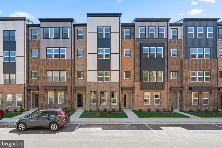 Contemporary townhouse, newly built in 2025, available for rent in desirable Paddock Pointe. Boasting 2,481 square feet of modern living space, this stylish home features 3 spacious bedrooms, 2 full bathrooms, and a convenient half bath. The entry level welcomes you with a large open family room—ideal for a playroom or cozy media lounge—with direct access to the one-car garage. Upstairs, the main level is designed for seamless everyday living and effortless entertaining. The open-concept layout connects the living and dining areas, enhanced by gleaming floors and a convenient powder room. Step out onto the private balcony from the expansive living room—perfect for relaxing or enjoying your morning coffee. At the heart of the home is a stunning kitchen outfitted with upgraded countertops, stainless steel appliances, a chic tile backsplash, ample white cabinetry, and generous counter space. The large center island with a breakfast bar and pendant lighting completes the space, offering both function and style. On the upper level, you’ll find two generously sized carpeted bedrooms, a laundry room ready for a washer and dryer hook-up, and two full bathrooms. The expansive primary suite offers a luxurious retreat with an ensuite bath featuring an oversized dual-sink vanity, a separate soaking tub and shower, and a spacious walk-in closet. Additional highlights include a one-car garage and an extra parking space. Recently installed window blinds and ceiling fans. Paddock Pointe is located within the sought-after Howard County School District and offers easy access to the Baltimore-Washington Parkway and I-95. Just minutes from Laurel Lakes Town Centre, residents also enjoy access to scenic community trails, a dog park, and beautifully maintained green spaces.