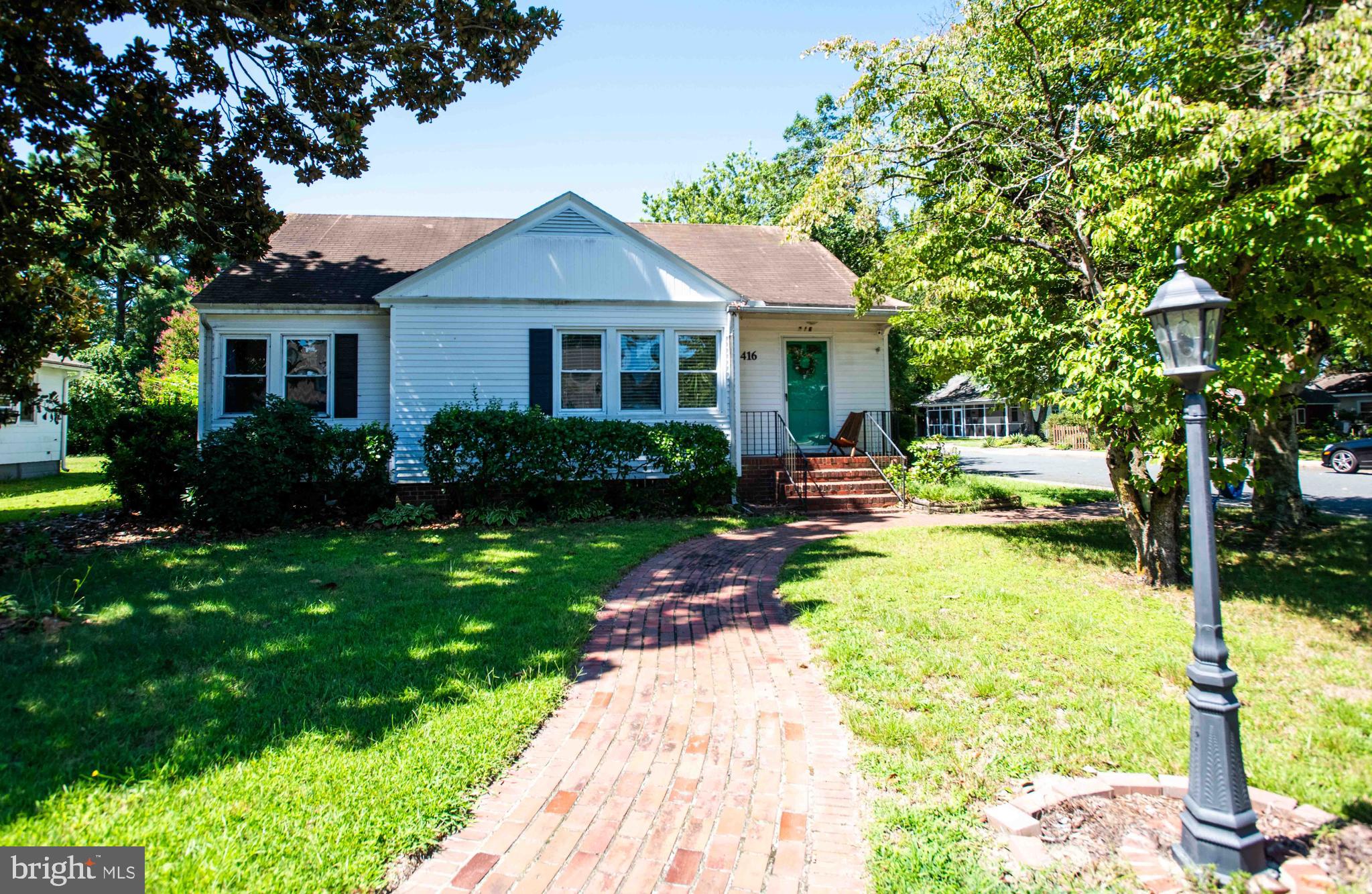 416 Truitt Street sits on a corner lot and includes a detached two car garage with a built in fireplace and grill. The garage also offers a separated space that can be used as a workshop or for additional storage. Inside, the home features four bedrooms and two full bathrooms, including an upstairs primary suite with a private bath and soaking tub. The main level offers a comfortable living and dining area with a wood burning fireplace and a kitchen with plenty of workspace. Large windows bring in natural light throughout the day, giving the home a bright and welcoming feel. This property provides a balance of space, function, and comfort both inside and out. Seller is motivated, creating an excellent opportunity for buyers looking for a smooth and timely purchase. A quick settlement is preferred, making this a great option for those eager to make 416 Truitt Street their new home without delay.