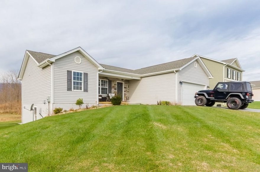 Hard to find split floor plan Rancher with desirable features and abundant storage space.  One level living at its finest - open spaces, hardwood flooring, stainless steel appliances, kitchen island, granite countertops, vaulted ceilings, large windows - and it all hits as soon as you walk through the front door.   On top of all that you will still find a large owner's suite with walk-in closet and adjoining bathroom, a nice deck off the kitchen with stairway to the back yard, a separate laundry room including washer/dryer, and a two-car garage for privacy and security.  Two guest bedrooms and a shared bathroom comprise the rest of the main floor.  If that is not enough space there is a very large walkout basement which has two windows to allow daylight and rough-in plumbing for a future bathroom.  The basement is already partitioned by a stud wall into two large spaces, ready to be finished.  All of this at an attractive price that just won't last!