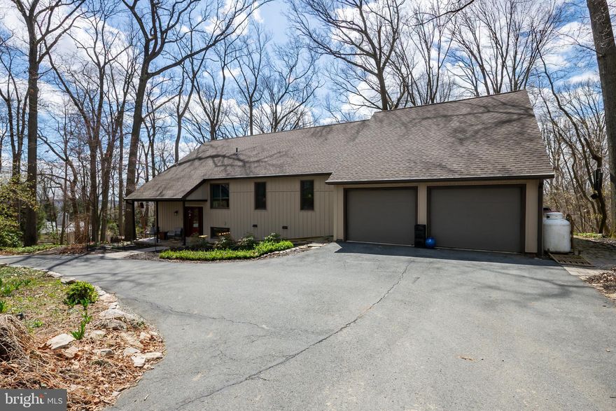 Welcome to this stunning wooded paradise nestled on over 4 acres in the desirable East Penn school district! This unique contemporary home may be one of the nicest homes you show all year! This custom home features nearly 2,800 square feet,  4 bedrooms and 2.5 baths, an attached 2-car garage as well as a large 3-bay detached garage. There have been many updates and high-end improvements done to this beautiful property.  Tucked away at the end of a cul-de-sac, the home offers tranquility and privacy.  It's not often that we come across a home that exhibits such thoughtful design and solid construction, but also CHARACTER. The main level showcases beautiful hardwood floors and just a ton of natural light. The expansive Andersen replacement windows flood the space with light on even the cloudiest days.  The windows provide picturesque views of the surrounding woods and truly bring the outside in. Wildlife abounds! The gourmet kitchen is a chef's delight, equipped with a Wolf downdraft gas cooktop, Wolf wall oven and microwave, a Sub-Zero built-in refrigerator, and built-in full freezer, plus an amazing quantity of solid cherry cabinets. The granite counters provide both a ton of workspace, a breakfast bar and a classic design. This eat-in kitchen is so well equipped. It includes a cool bookshelf plus 3 pantries! They can be used for a variety of purposes for storage of all types. One of the highlights for us is the large screened in porch. Step outside to experience the peacefulness of nature. I guarantee that you will want to dine out there as often as possible. The owner's suite is conveniently located on the main level, adjacent to a spacious full-remodeled bathroom. The owner's suite also features 2 walk in closets.  A full-service laundry room completes the main floor.  Did I mention that all of the bathrooms have been redone? And redone beautifully! In fact the sellers have included a list of all that they've done since taking possession. It is actually well over $400,000 in upgrades. They hate to leave it behind but they must move on to their next adventure. The lower level features a fantastic rec room with a bar area and leads out to a large paver patio. The theme again is all about natural light. Three additional large bedrooms, a second full-remodeled bathroom, and ample storage are also found on the lower level. For added peace of mind, the home includes a full house propane generator. This home is like being on vacation everyday! Please come and enjoy serene living in your private, wooded retreat.  Worried about no basement? There is a massive unfinished attic area with walk-up steps that has a ton of potential to add value to the home. Tons of storage or plenty of room to add more bedrooms or living space. The septic system is almost brand new and there are actually two as they left the original one in place. Inquire within for a list of all the updates!
This home, while being in the secluded community of Sun Valley Estates, is close to so many great restaurants and amenities. Gotta Have A Wawa? There are a number close by.