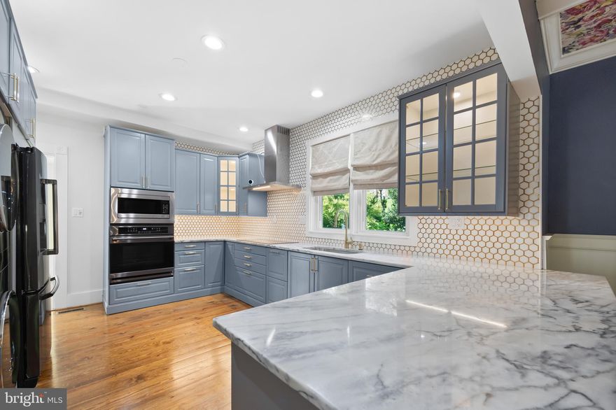 The perfect combination of timeless charm and modern luxury — welcome to 118 Luray Avenue! This beautiful home was completely remodeled in 2022, enhancing everything that makes it special while updating everything else, literally from the roof down. Entering through the front door, you will immediately notice the striking original hardwood floors, all of which have been sanded and refinished. To the right, you'll find the open concept dining area (featuring stunning custom coffered ceiling) and kitchen (featuring built in pantry and all new modern lighted cabinets, 180 degree marble countertops, and all new appliances including convection cooktop and oven, with beautiful custom tile backsplash, all the way from the marble counters to the ceiling). Attached to the kitchen is a completely remodeled sunroom, perfect for sitting and relaxing in the natural light. Exit from the sunroom onto the rebuilt Trex back porch and enjoy the outdoors. The main floor is rounded out by a half-bathroom, spacious living room perfect for entertaining guests, and a flex room, historically used as a bedroom but perfect for a home office. Upstairs, you'll find three well-appointed bedrooms, including and especially the primary bedroom, complemented by a generous closet, packed with custom amenities including shoe racks, pull out drawers, and jewelry holders. The primary bathroom is equally as extravagant, featuring a marble shower with double shower heads, a double vanity, and a customizable backlit mirror with anti-fog feature. The upstairs hall bathroom is no less remarkable, also featuring a double vanity and marble shower. There are truly too many updates to name in this charming Colonial home, situated on a generous in-town lot in a quiet corner of Front Royal. Schedule your showing and see it all for yourself today!