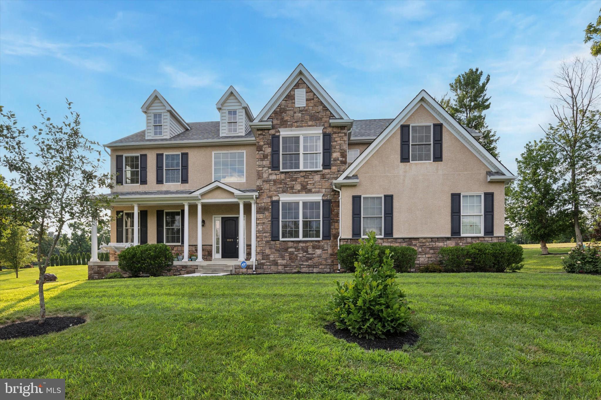 Welcome to 801 N Park Ave in Lower Providence Township, PA—a beautifully maintained Colonial home located in the sought-after Methacton School District. Built in 2016 and set on a spacious 0.69-acre lot, this 4-bedroom, 2.5-bath residence offers over 3,200 square feet of elegant living space. The home features striking curb appeal with a covered front porch, stone accents, and a two-car side-entry garage. Inside, you'll find a grand two-story foyer with a turned oak staircase, formal living and dining rooms with crown molding and chair rail, and a gourmet eat-in kitchen with granite countertops, 42” cabinetry, stainless steel appliances, and a center island. The light-filled family room includes a vaulted ceiling and cozy gas fireplace, while a private office with French doors provides the perfect work-from-home space. The luxurious primary suite boasts two walk-in closets and a spa-inspired bath with double vanity, walk-in shower, and jetted tub. Three additional bedrooms and a full hall bath complete the upper level. The 9-foot-ceiling basement offers endless potential for customization. Conveniently located near Routes 363, 422, 202, 76, and 476, and close to shopping, restaurants, and recreational amenities, this home combines comfort, style, and accessibility in a prime suburban setting.