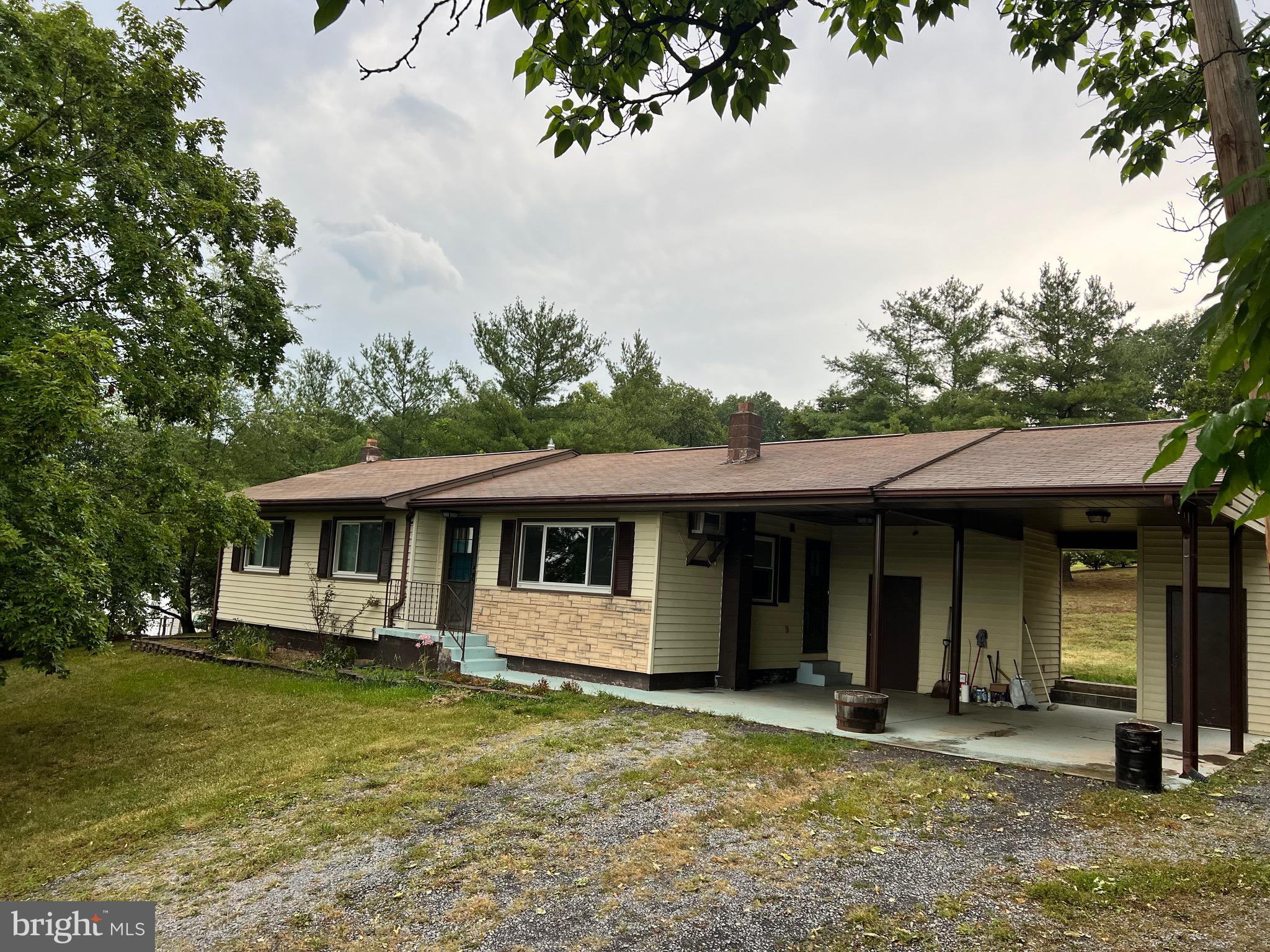 Great starter or retirement home. Well built three Bedroom/2 Bath Rancher with two space attached carport. Finished basement with Family Room, Bathroom and Laundry room. Sits on a small ridge and has beautiful scenic view above the roof tops below! Only two miles south of Petersburg city limits, so very convenient location for commuting to work or school!