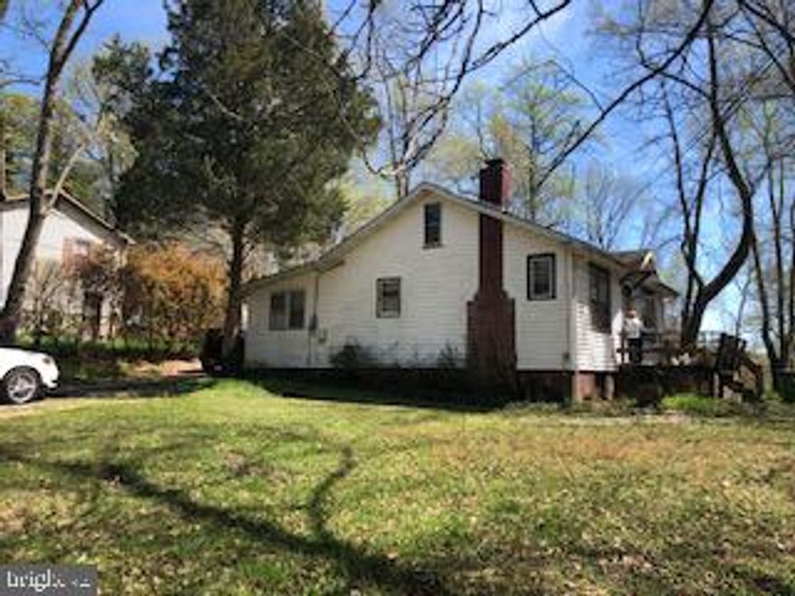 Amazing opportunity to own 2 homes on a Large Corner Lot!  Loads of Potential!  Homes need a little TLC and sold "as is" condition.  Main Home is 2 story 2 Bedrooms & 1 Bath.  Smaller Home is single level 1 Bedroom & 1 Bath.  Super Location! Walk to Quantico Golf Course.