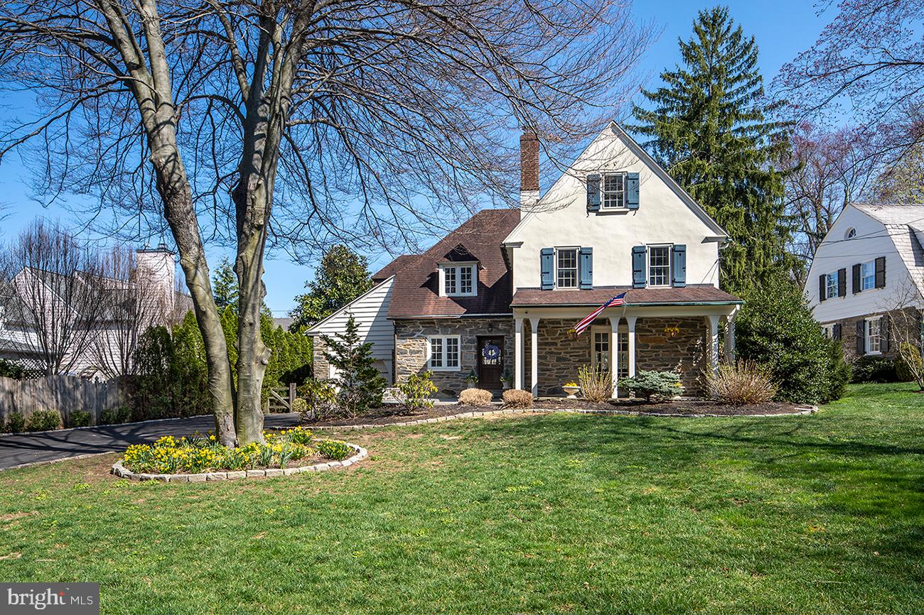 This turn of the century charmer on one of the only private lanes in S Wayne is as enchanting as it gets! The beautiful English-style stone residence retains its unique character yet has been lovingly renovated for modern needs, with an open floorplan and refined finishes throughout. Your family will love living on picturesque landscaped grounds, in a desirable family neighborhood walkable to Downtown Wayne, Radnor Trail, schools, restaurants, and 2 train stations. Or stay at home in your oasis to enjoy a perfect blend of old and new, and the best that nature, a front porch, new slate patio, and large fenced-in yard have to offer. A 2-story foyer greets you inside and opens to gracious living and dining quarters. Entertain guests in the inviting living/family room enriched by original hardwood floors with inlay and a gas fireplace, with French doors creating a seamless flow out to the covered patio. Serve a large group in the elegant formal dining room that’s perfect for sit-down meals, celebrating holidays and special occasions, overlooking the lush backyard. The gourmet kitchen is the heart of the home, impeccably appointed for the cook, featuring marble countertops, a large center island, abundant wood cabinetry, Liebherr refrigerator (2018), Bosch oven and microwave (2020), Bosch dishwasher (2019), and French doors to the flagstone patio. Completing the main level is a new built-in marble wet bar between the kitchen and living area, tasteful powder room, and convenient mudroom leading to the attached garage. Ascend the staircase to level 2 where your generous primary suite awaits. Unwind in the tranquil bedroom complemented by new custom California Closets (2020), and an exquisite marble bathroom graced by dual vanities and an oversized walk-in shower. Two additional bedrooms with custom California Closets (2020), a full hall bath and a laundry room round out the comfort. On the 3rd story sits a very sizable vaulted bedroom, playroom or office space with its own lovely full bath. A dry finished basement with full French drain and new backup sump pump, new central AC & heat, plus remote control of Lucent lighting and Nest, cameras, doorbell and thermostats make this a worry-free gem! Top that off with a prime central location in coveted Radnor Township, in the sought-after community of S Wayne. Live on a quiet street with great neighbors, a countryside feel, and close proximity to all amenities.