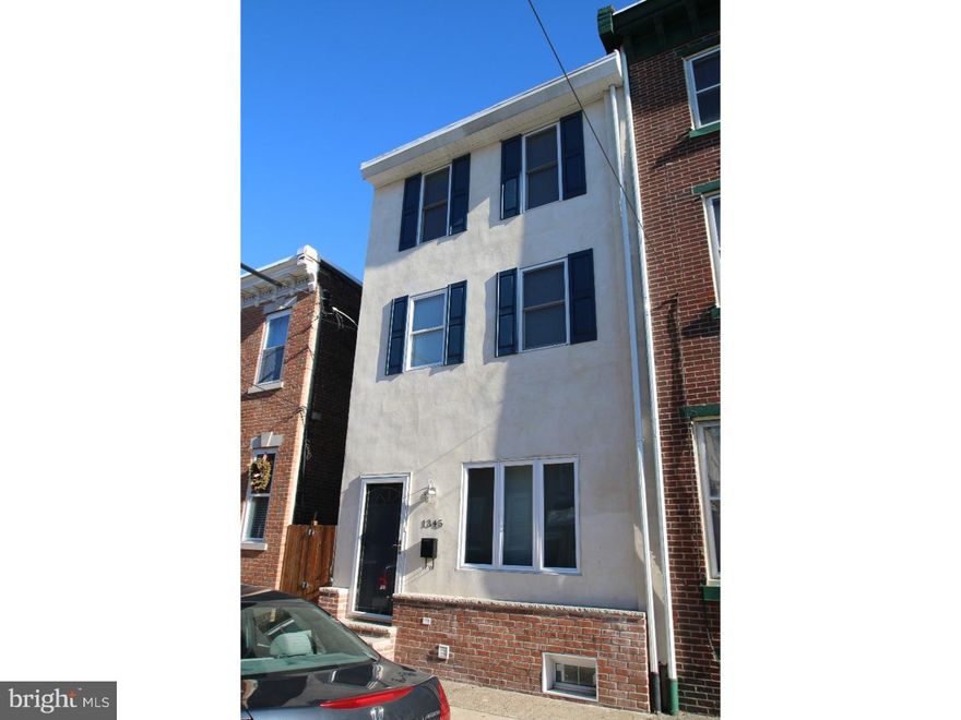 MOVE IN READY 3bed/2.5bath with Beautifully Landscaped Rear Yard in ultra-walkable Fishtown location.  This totally renovated home is the one you've been waiting for!  Enter into light filled main floor living room with beautiful hardwood floors and enjoy entertaining in dining area with the added convenience of powder room. Dynamite kitchen features high end stainless steel appliances, granite counter tops and glass tile back splash. Track lighting and sleek cherry cabinetry provides exceptional storage. Huge rear patio/yard will make all of your friends jealous - perfect for summertime barbecues and gardening! Second floor boasts 2 large beds with plenty of closet space and 2 full baths with tile surround and modern finishes. Spiral staircase leads to third floor bedroom offering amazing city skyline views and vaulted ceilings. Large finished tile basement and attractive brick and stucco fa ade w/ shutters ? tons of curb appeal! Just a few blocks away from thriving Frankford Ave. filled with new bars, restaurants and cafes.