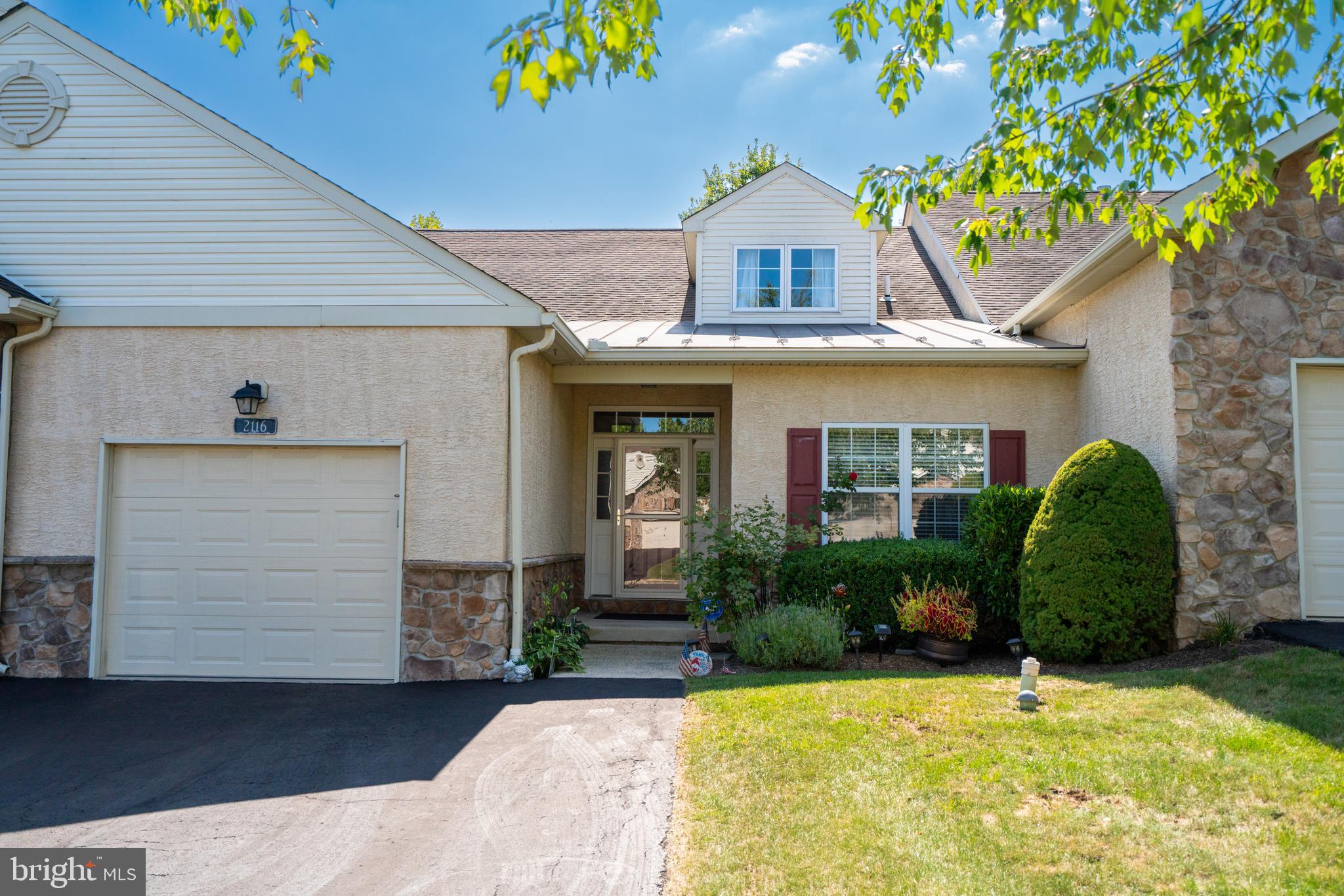 Spacious, airy, and lovingly maintained interior townhome in the 55+ community of Hidden Meadow. This 2 Bedroom, 2 Full Bath unit boasts approx. 2,255 square feet of living space, and includes a large upstairs Loft and full unfinished Basement. Walking through the front door, you'll notice an open floor plan with gleaming hardwood floors, well-sized Kitchen with plenty of cabinet and counter space, stainless-steel appliances, room for eat-in area or kitchen island, and roll-out shelves & lazy Susan. The HUGE Dining/Living Area offers plenty of room for entertaining friends and family over the holidays, cathedral ceilings, ceiling fan, and access to the back deck with retractable awning. The ample sized Primary Bedroom is located off the Living Room with neutral carpeting, large walk-in closet, and tile bathroom with double sink and walk-in shower. The secluded second Bedroom has easy access to the second full Bath with tub. The main-floor Laundry Room with access to the one-car Garage rounds out the first floor. The upstairs Loft provides extra living space that can be used as a possible additional Bedroom area or Family/Rec Room. There is even an extra "dormer area" attached to the Loft with plenty of light that can be used as an office/media space, play area, plant nursery, or the potential for finishing off as an extra upstairs Bathroom. Upgrades to the home include: new Water Heater 2024, newer HVAC (2018), newer storm door (2020), and newer Sump Pump (2021). Located on a quiet street, this community is minutes from the Colmar train station with easy access to 309, 63, 202, Costco, BJ's, Wegman's, Lowe's Home Depot, and all kinds of shopping and dining. North Penn Schools.