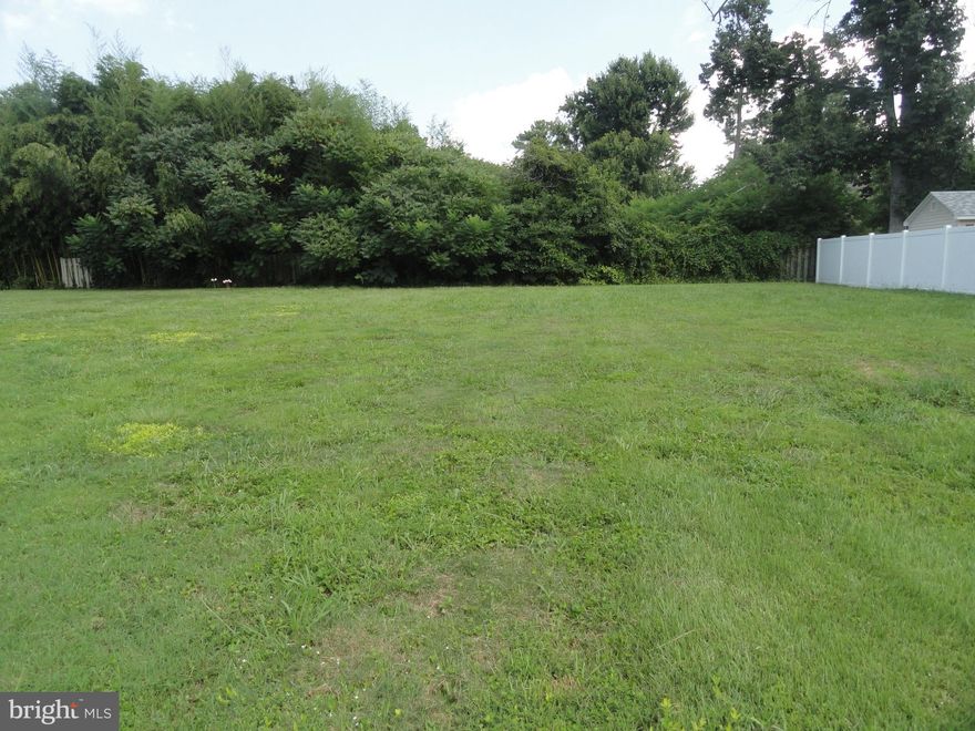 One of the last remaining buildable lots in Bay City. This lot offers everything. Easy access to the Bay Bridge, schools close by, and close to shopping & restaurants. Yet still tucked away in a community setting with primarily 1/3 acre lots--some breathing space. Just a short walk to Bayside Dr. where you can look out to the beautiful Chesapeake Bay. Community offers a tot-lot and community picnic area right on the Bay as well as a boat ramp & pier on Broad Creek which offers short access to the Chesapeake. The water & sewer assessment is paid in full and since there was previously a home on this lot, owner says per County no "impact fees" are due. What a savings.  Grab it now before it is gone!